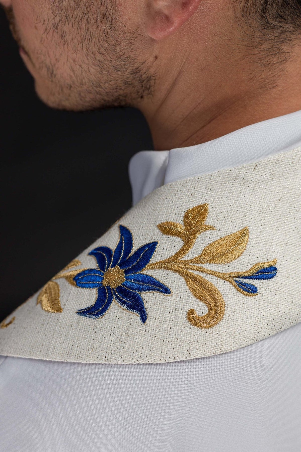 Embroidered stole back view with gold cross and blue and gold floral embroidery