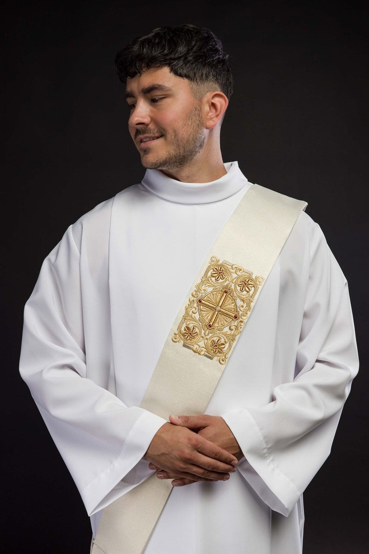 Deacon stole close-up showing ornate gold embroidered cross and floral motifs
