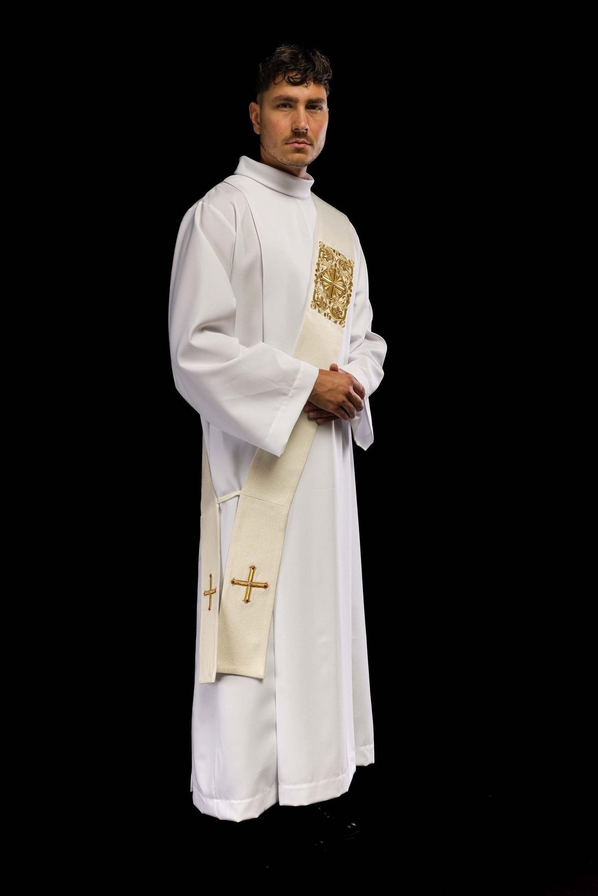 Deacon stole worn three-quarter view showing ivory fabric, ornate embroidery and gold crosses