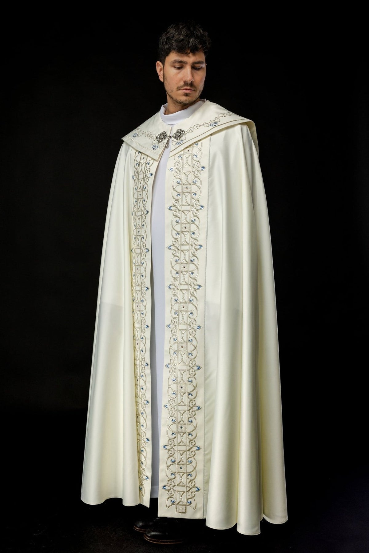 Ivory cope side view with long embroidered front panels