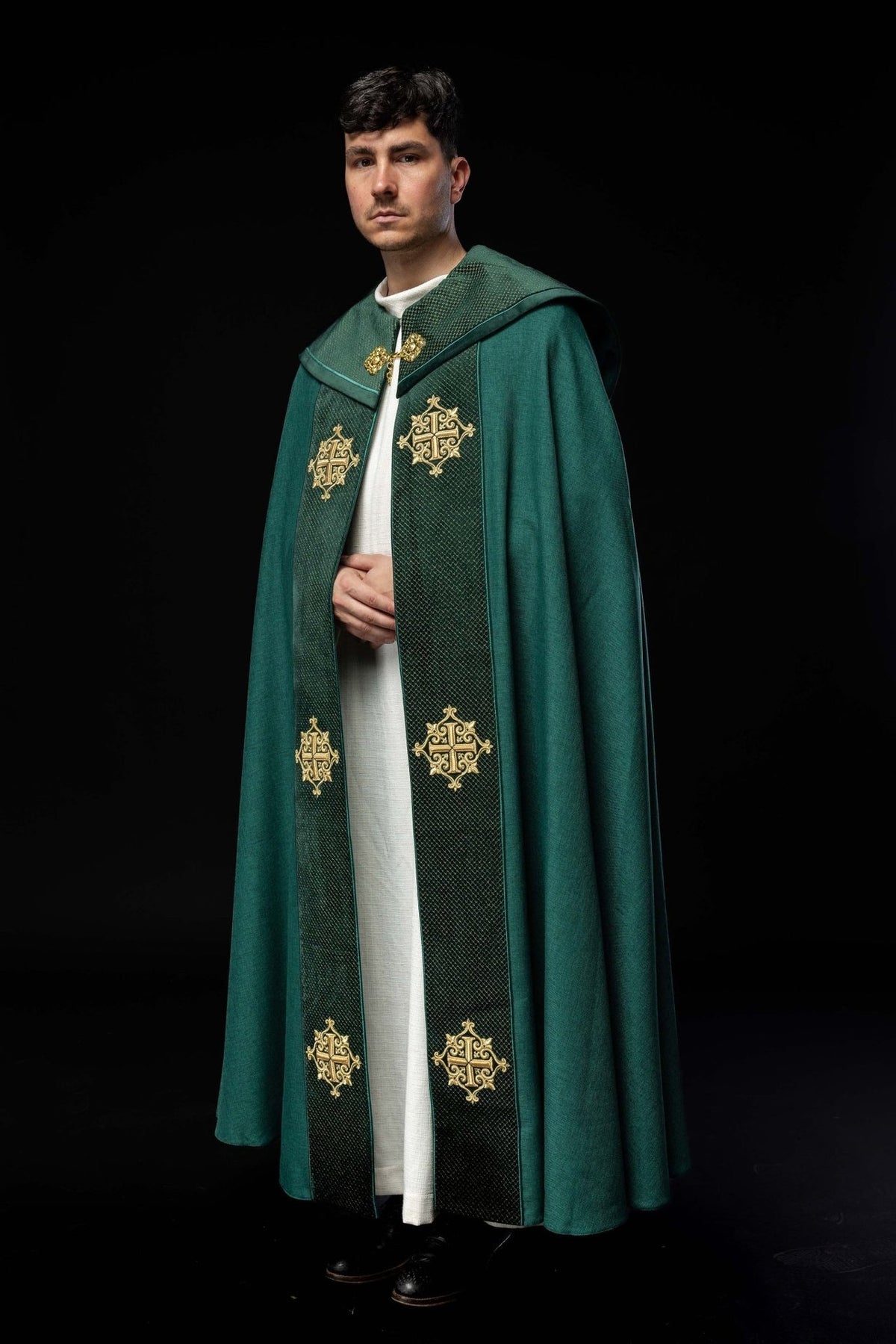 Green velvet cope, front view with embroidered cross orphrey and gold crosses