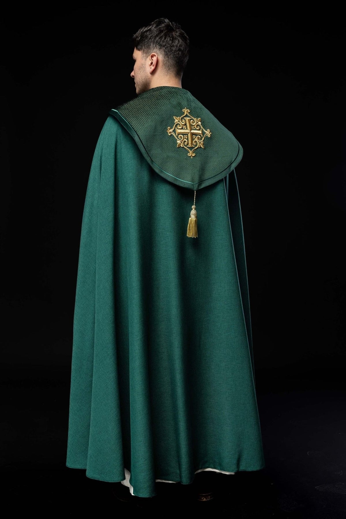 Green velvet cope, full back view with embroidered cross and tassel