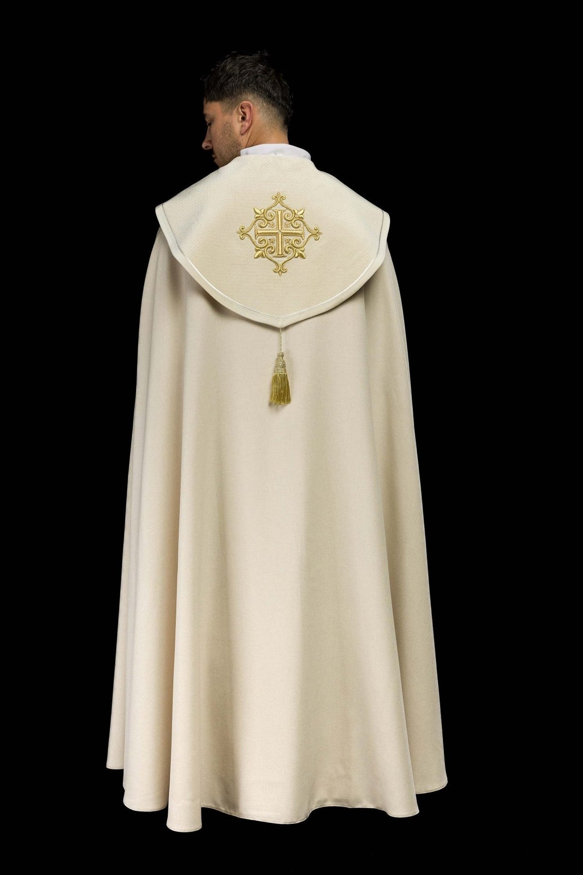 Ecru cope back view with gold cross embroidery and hanging tassel