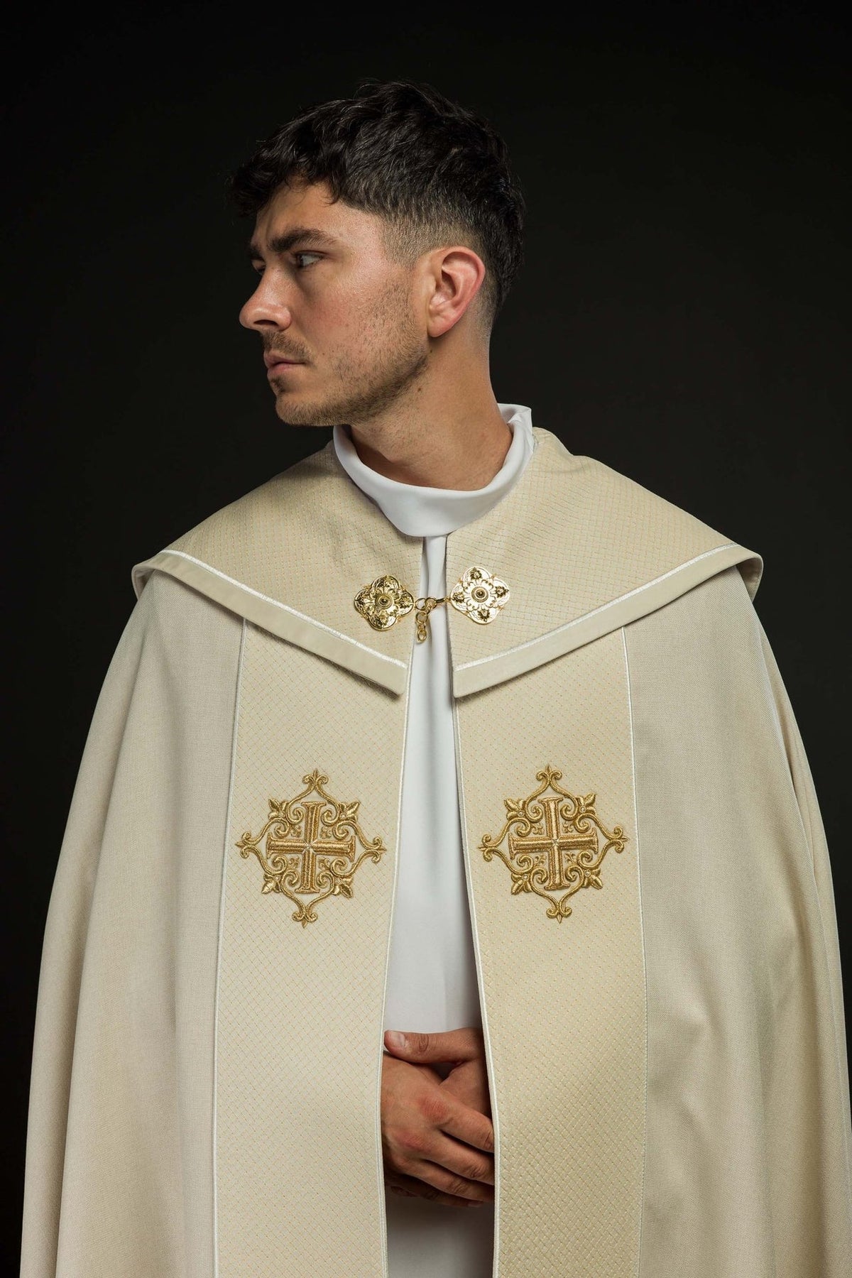 Ecru cope upper front close-up with velvet orphrey, clasp and gold cross embroidery