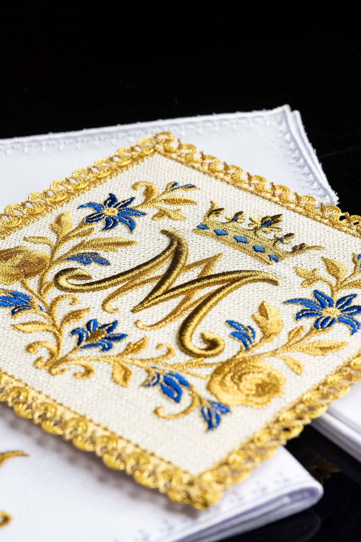 Altar linen set close-up with gold and blue Marian symbol embroidery