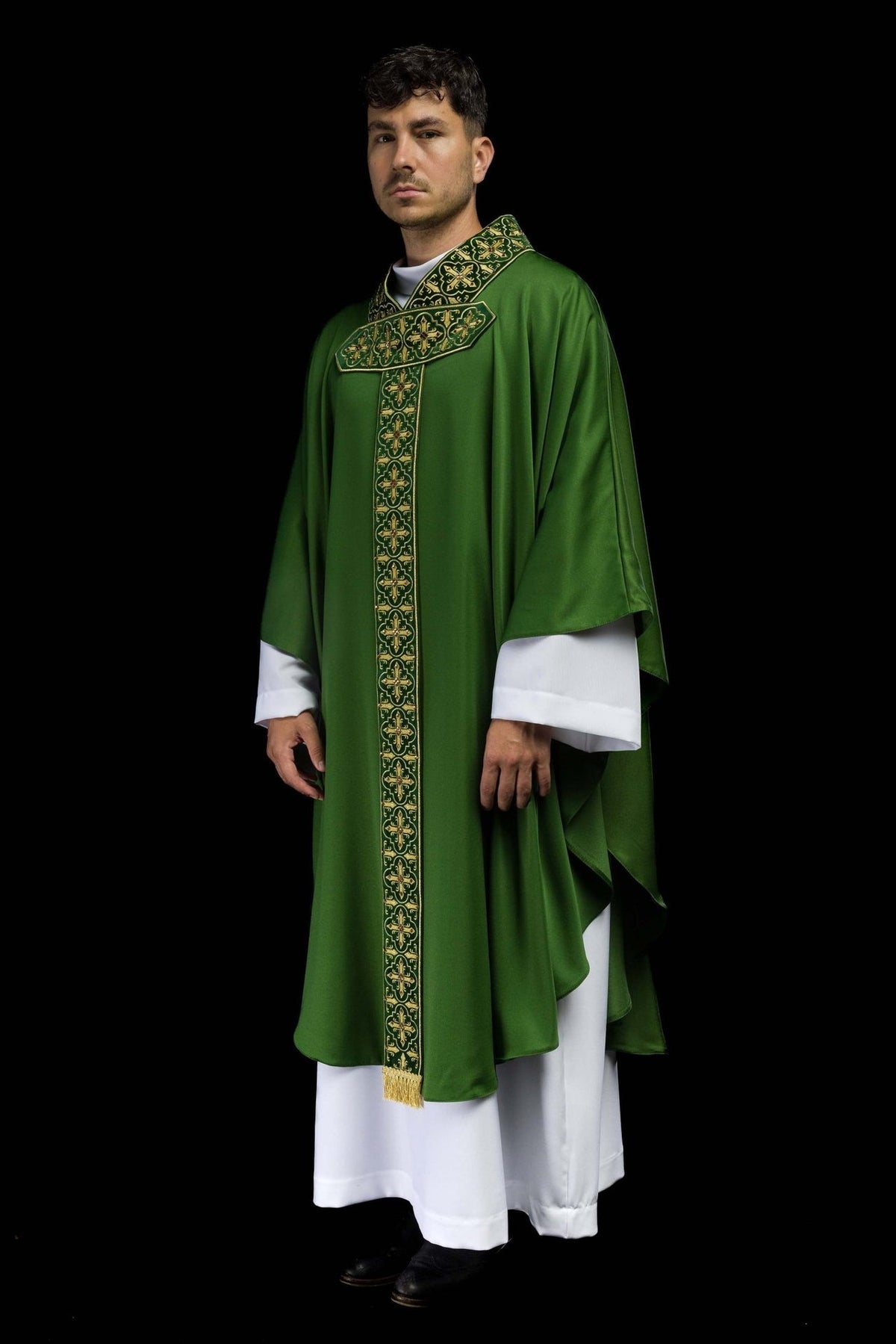 Green chasuble, side view showing flowing shape and embroidered orphrey