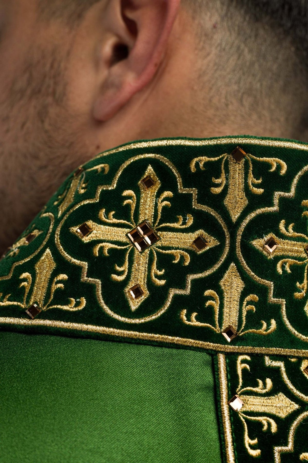 Green chasuble, close-up of orphrey end with gold fringe