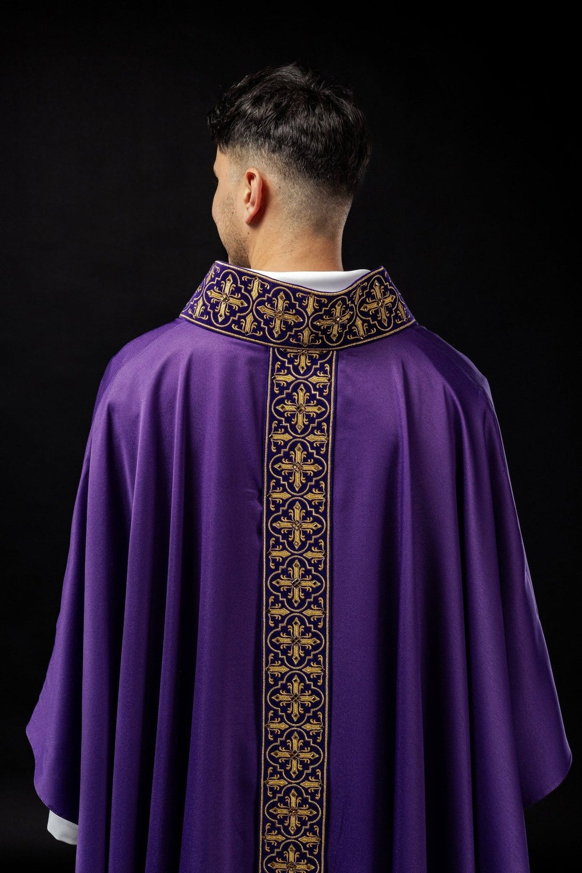 Purple chasuble back view with embroidered gold cross orphrey and collar