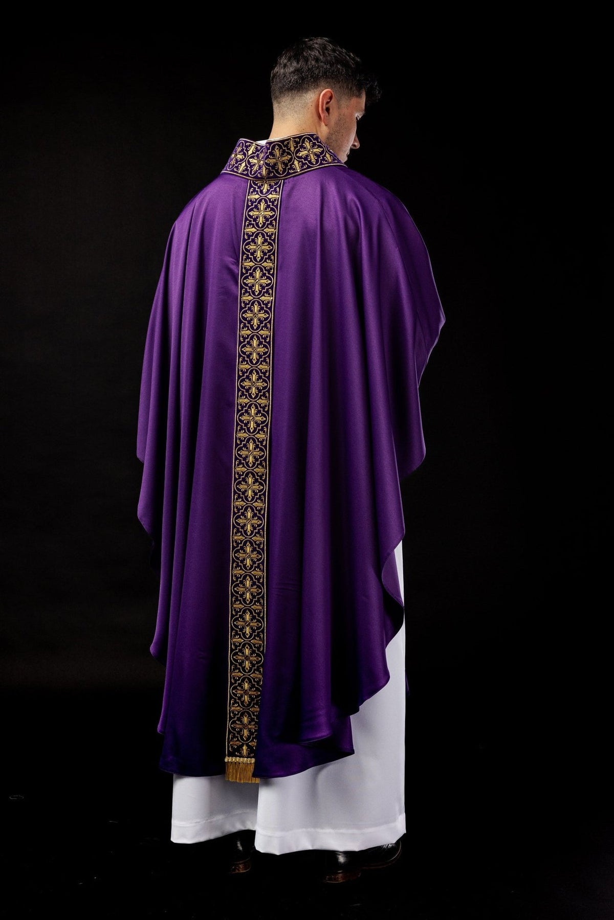 Purple chasuble rear three-quarter view with embroidered cross orphrey and trim