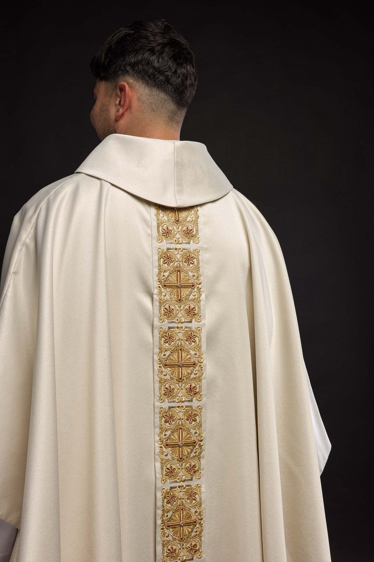 Chasuble back close-up showing the stand-up collar and embroidered gold orphrey