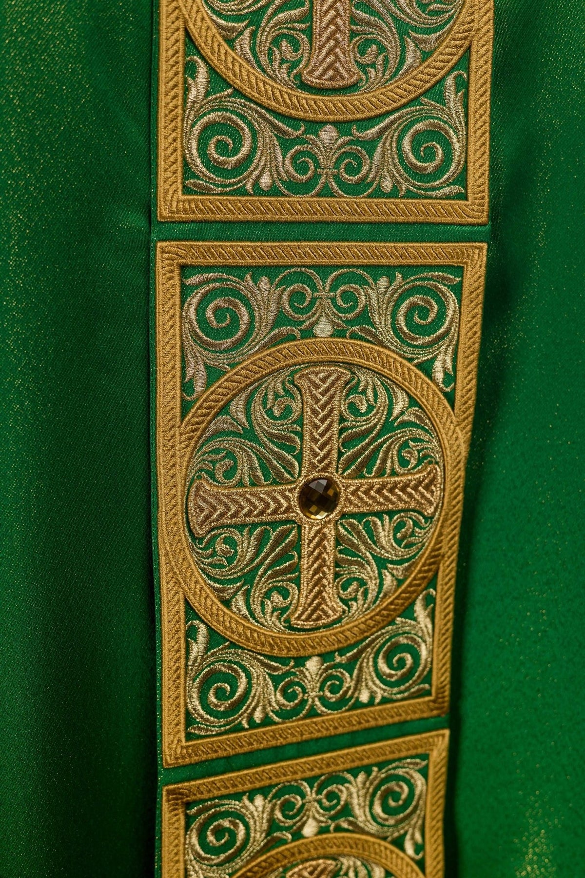 Green chasuble back view with embroidered orphrey and cross motifs