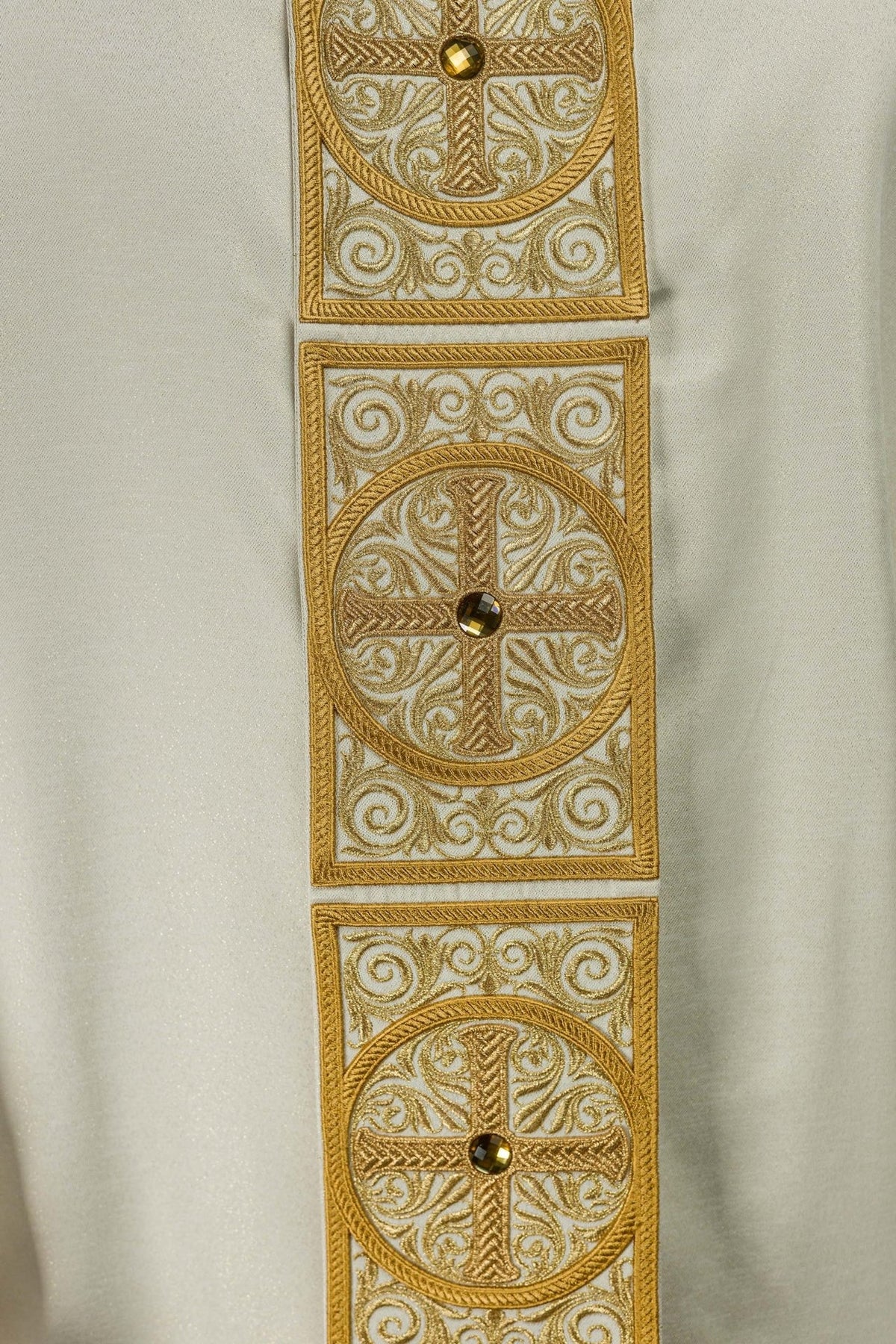 Gold chasuble fabric and embroidered orphrey detail