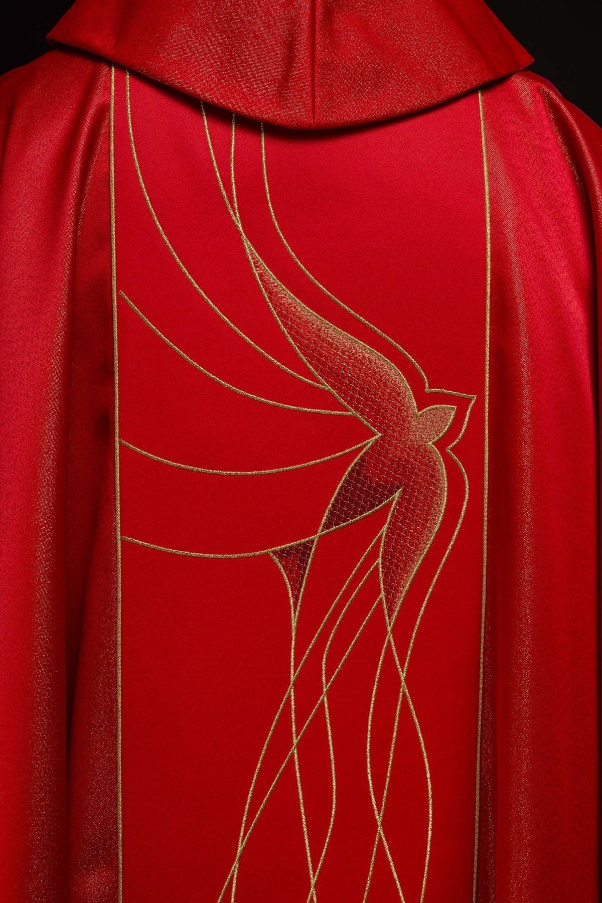 Red chasuble back view with Holy Spirit embroidery and gold edging