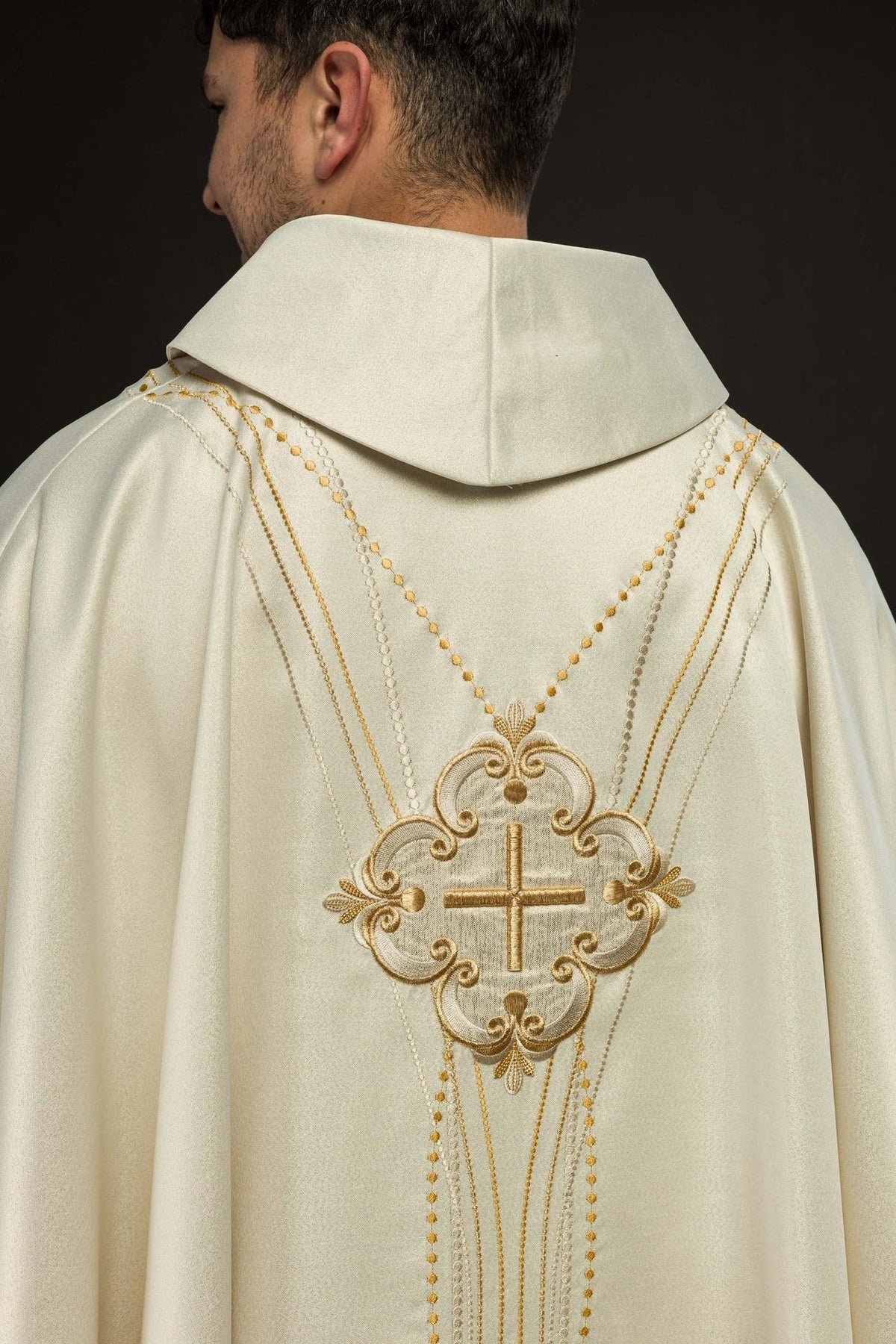 Ecru chasuble back view with matching cross motif and vertical embroidery