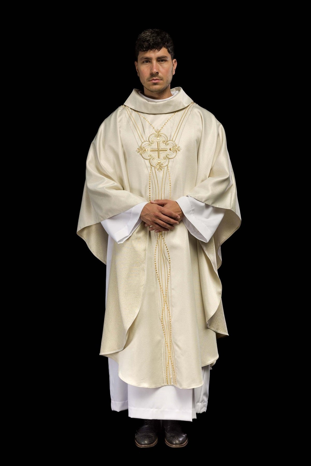Ecru chasuble front view showing wide sleeves and shimmering fabric