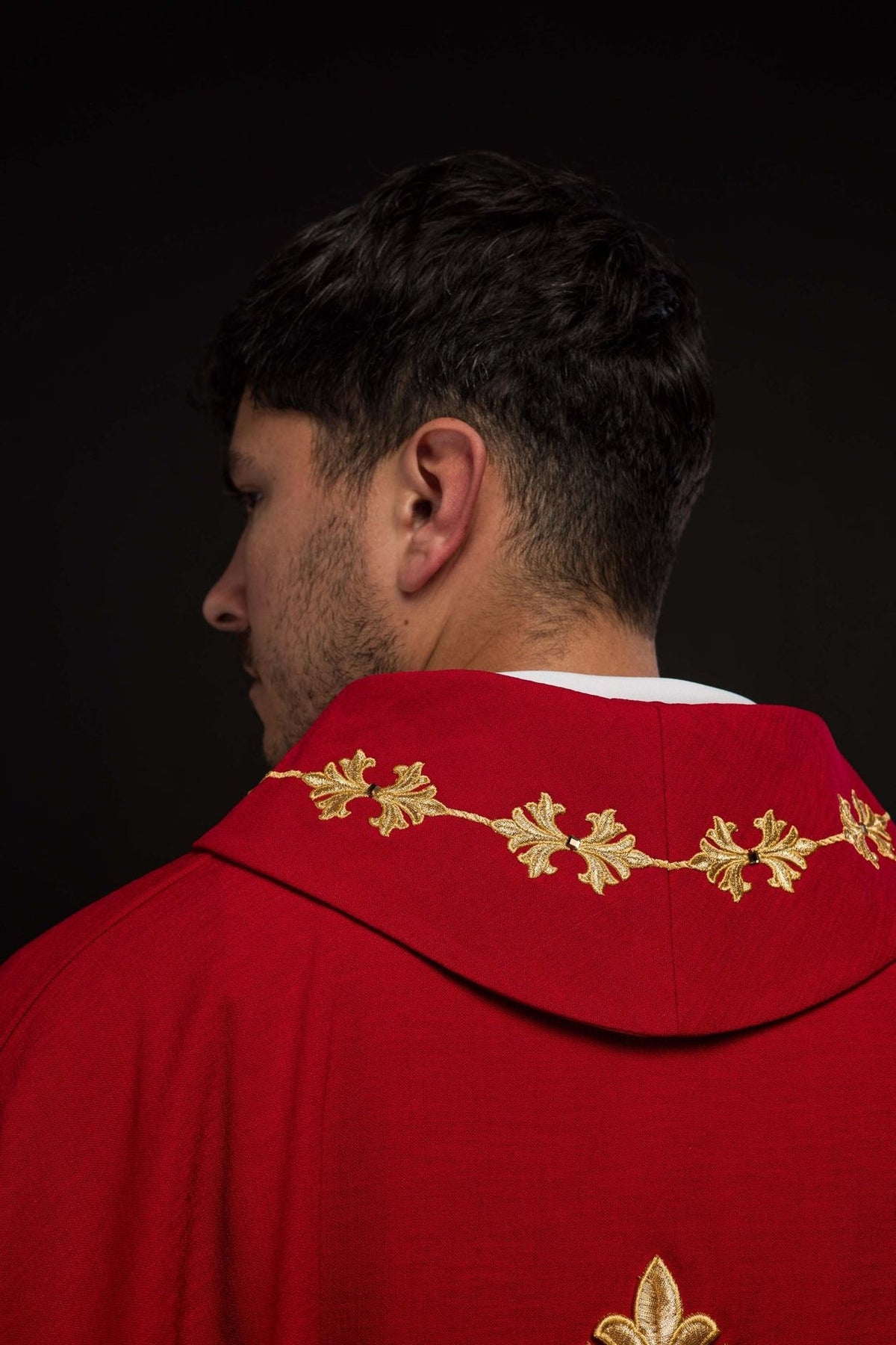 Red chasuble, side-back view showing gold embroidered stand-up collar