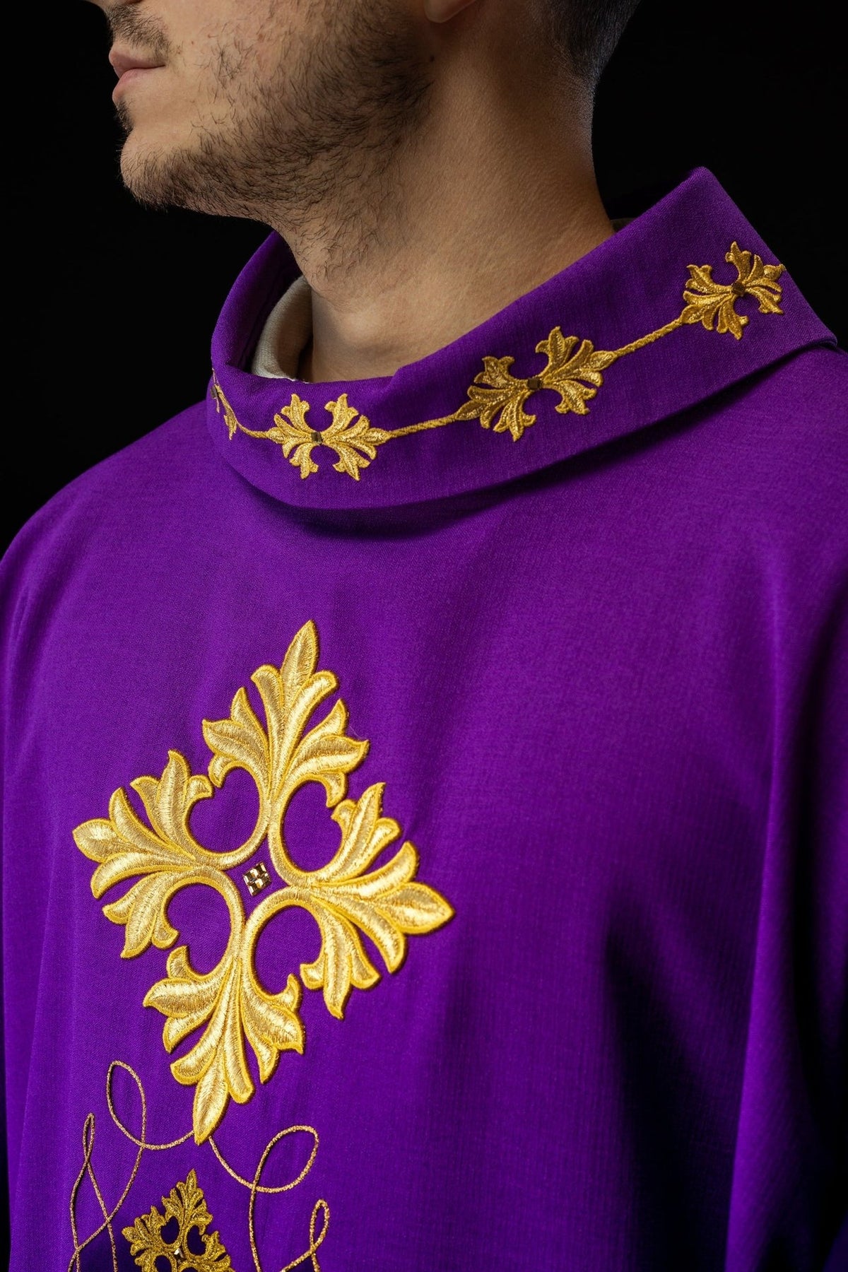 Purple chasuble side close-up showing the stand-up collar and gold embroidered cross