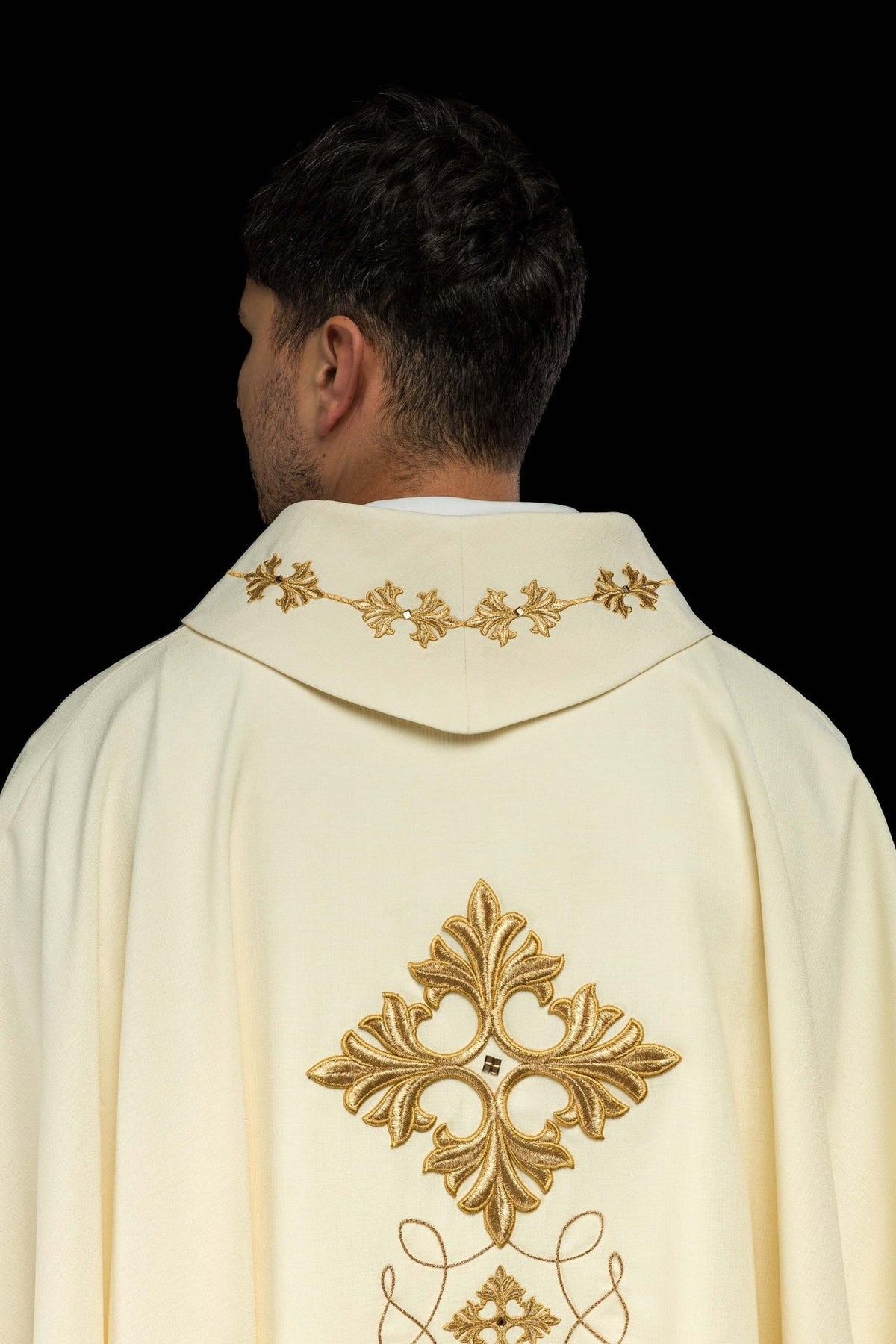 Embroidered chasuble back close-up with gold cross and leaf motifs on the collar