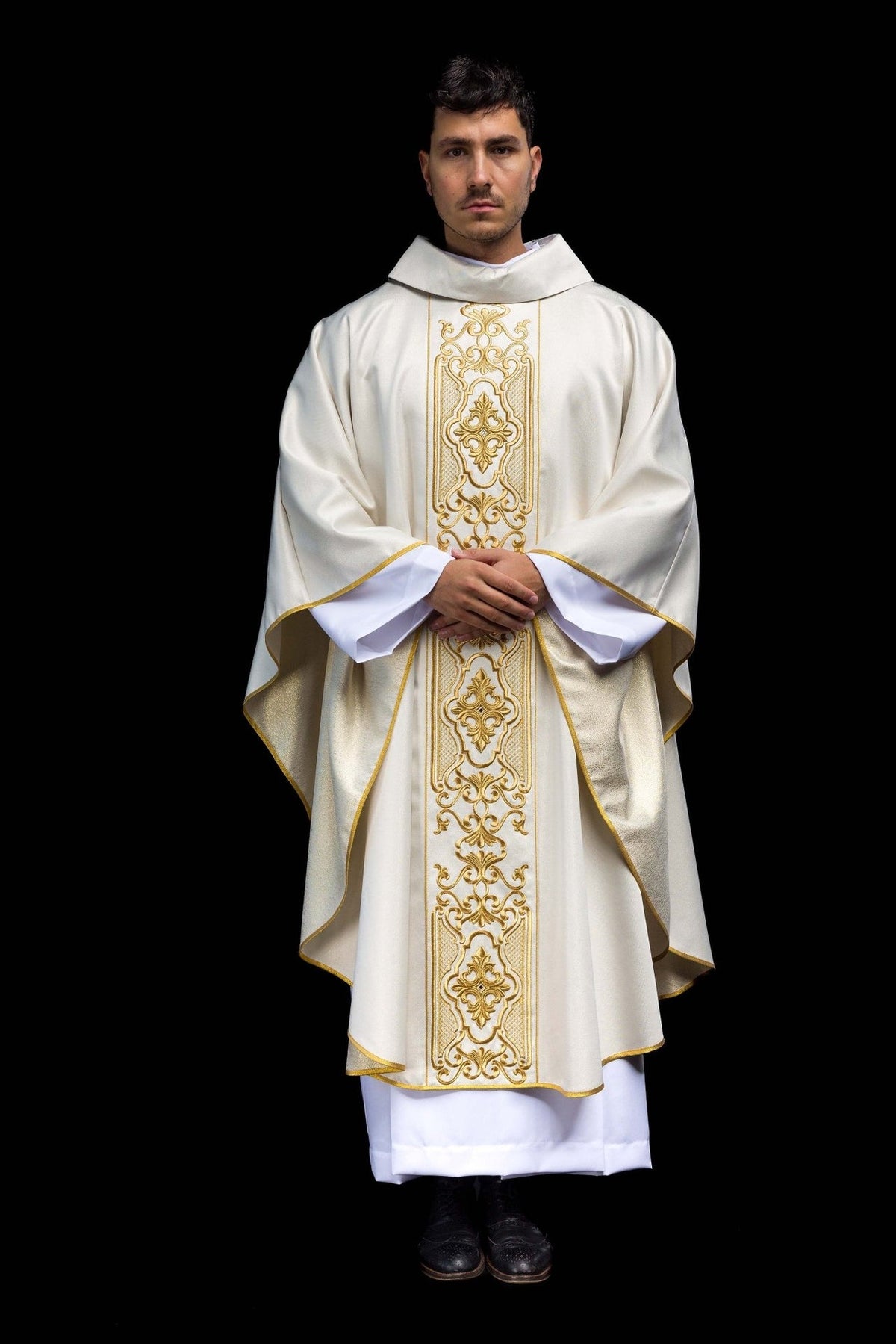 White chasuble worn front-facing, with full gold embroidered orphrey and gold trim