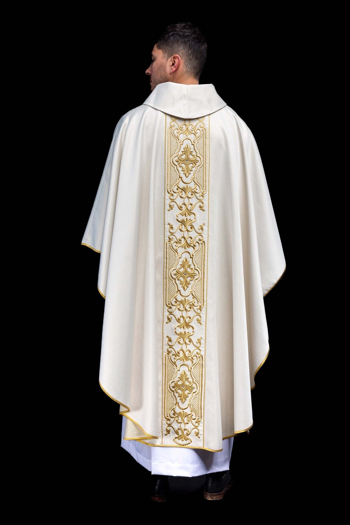 White chasuble full back view with long gold embroidered orphrey and gold trim