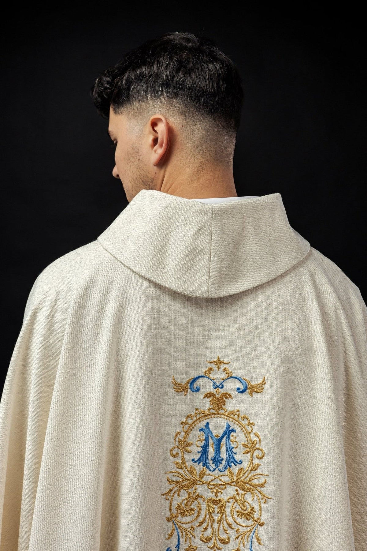 Ivory chasuble back close-up with stand-up collar and blue and gold embroidered panel