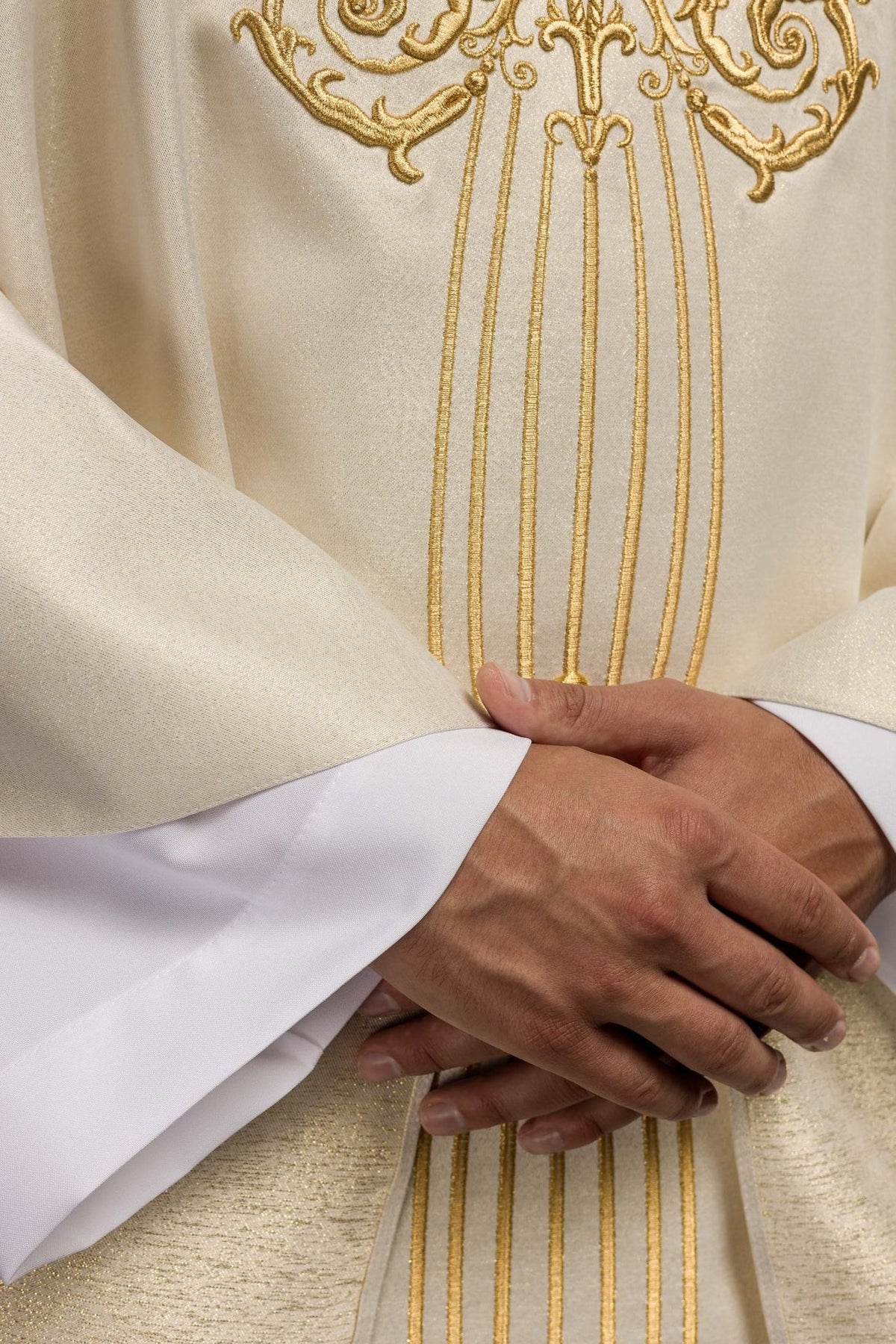 Ecru Marian chasuble close-up of gold embroidered Marian motif and vertical lines
