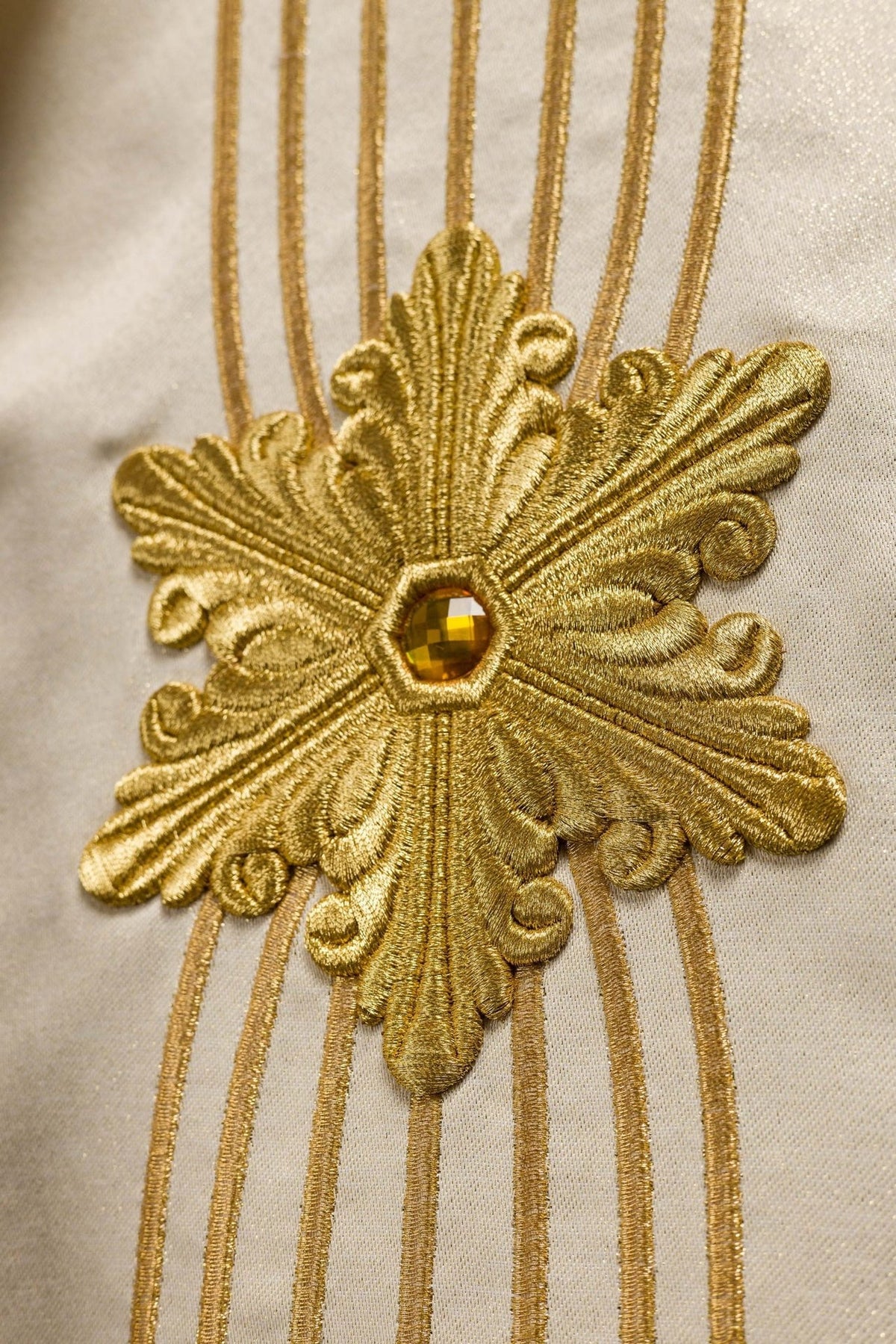 Ecru chasuble back view with gold vertical embroidery and floral motifs