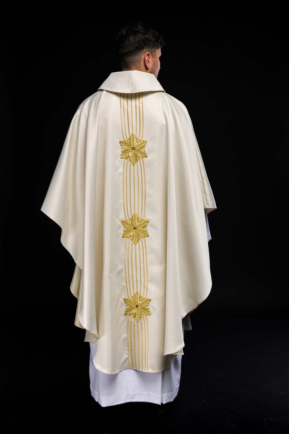 Ecru Marian chasuble back view with three gold embroidered floral motifs