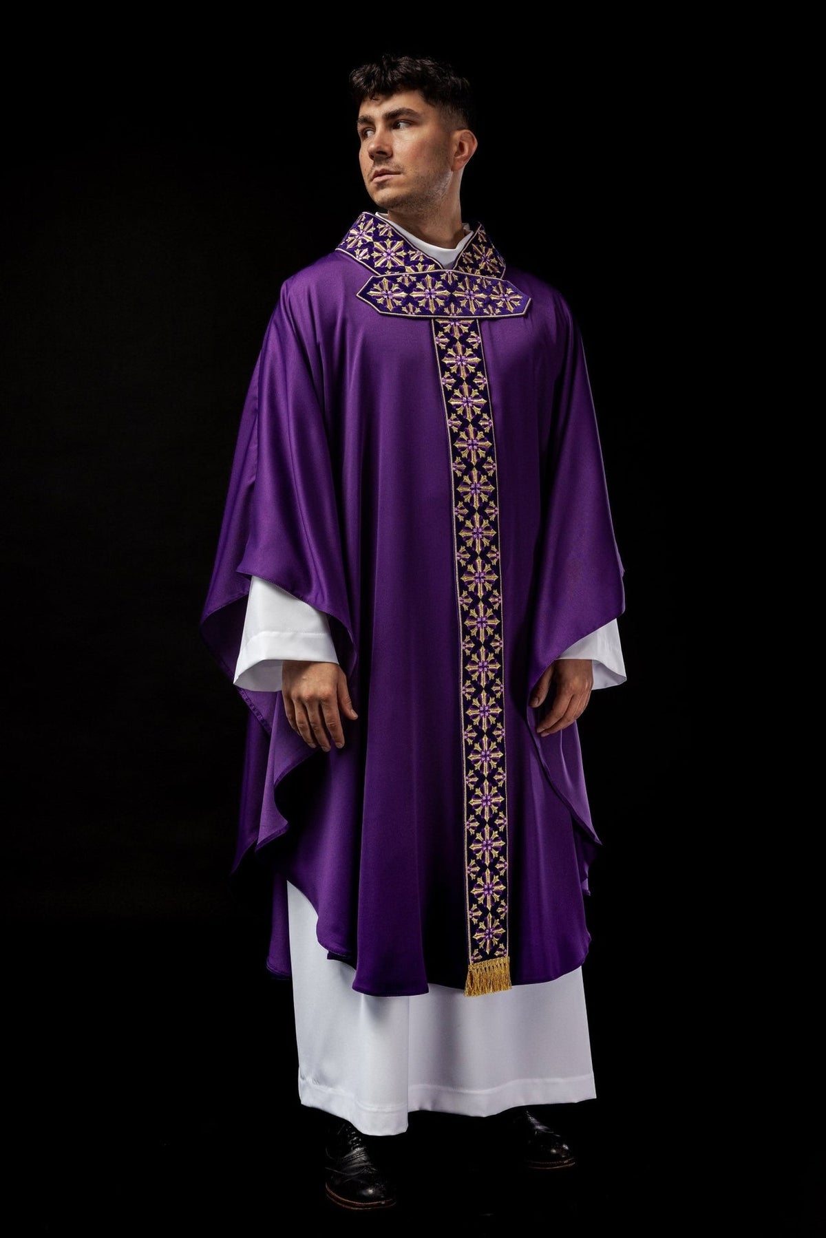 Purple chasuble, full front view with gold cross embroidery and decorative vertical trim