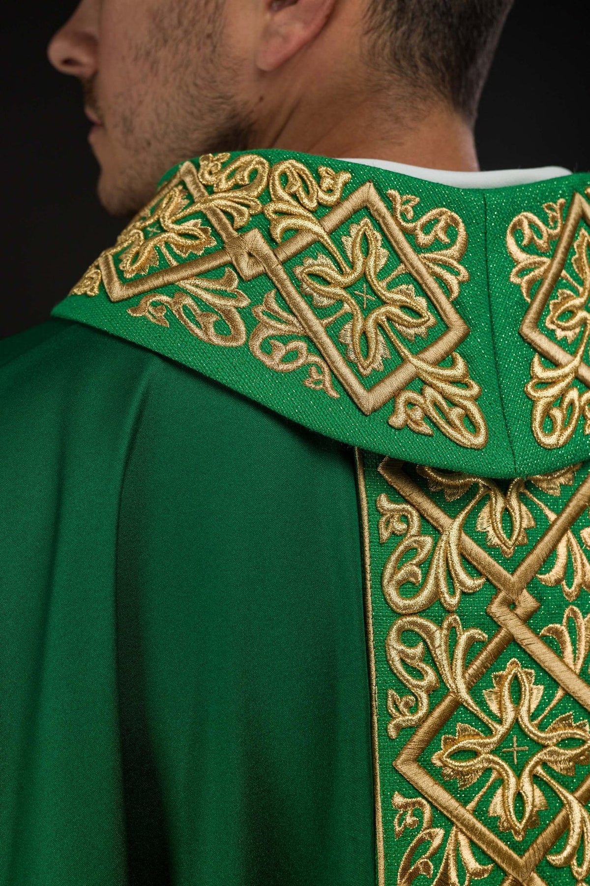 Green chasuble stand-up collar close-up with gold floral embroidery