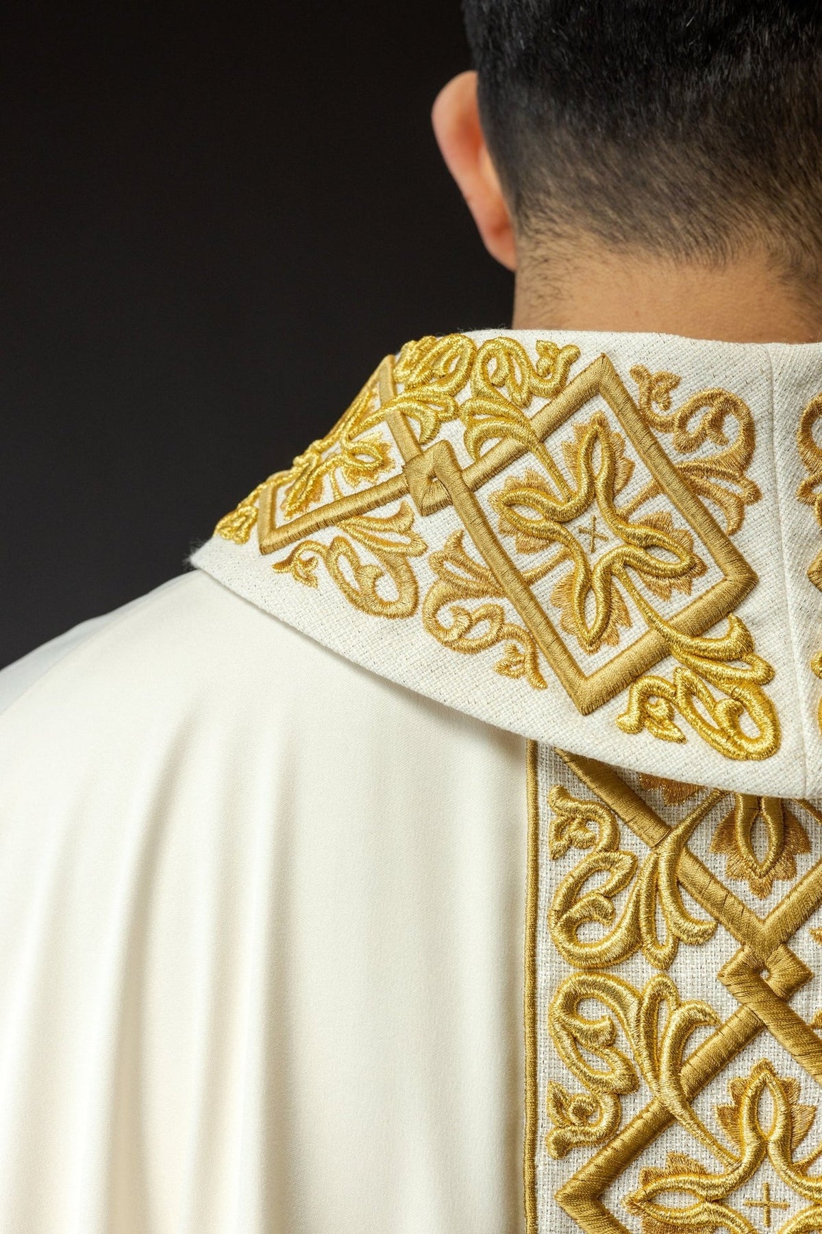 Ecru chasuble close-up of gold embroidered stand-up collar