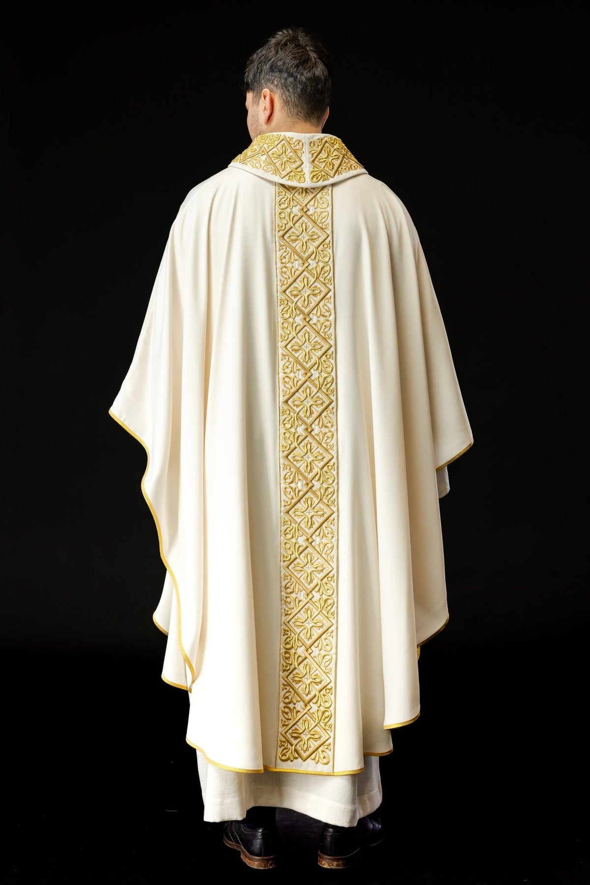 Ecru chasuble back view with full gold embroidered trim