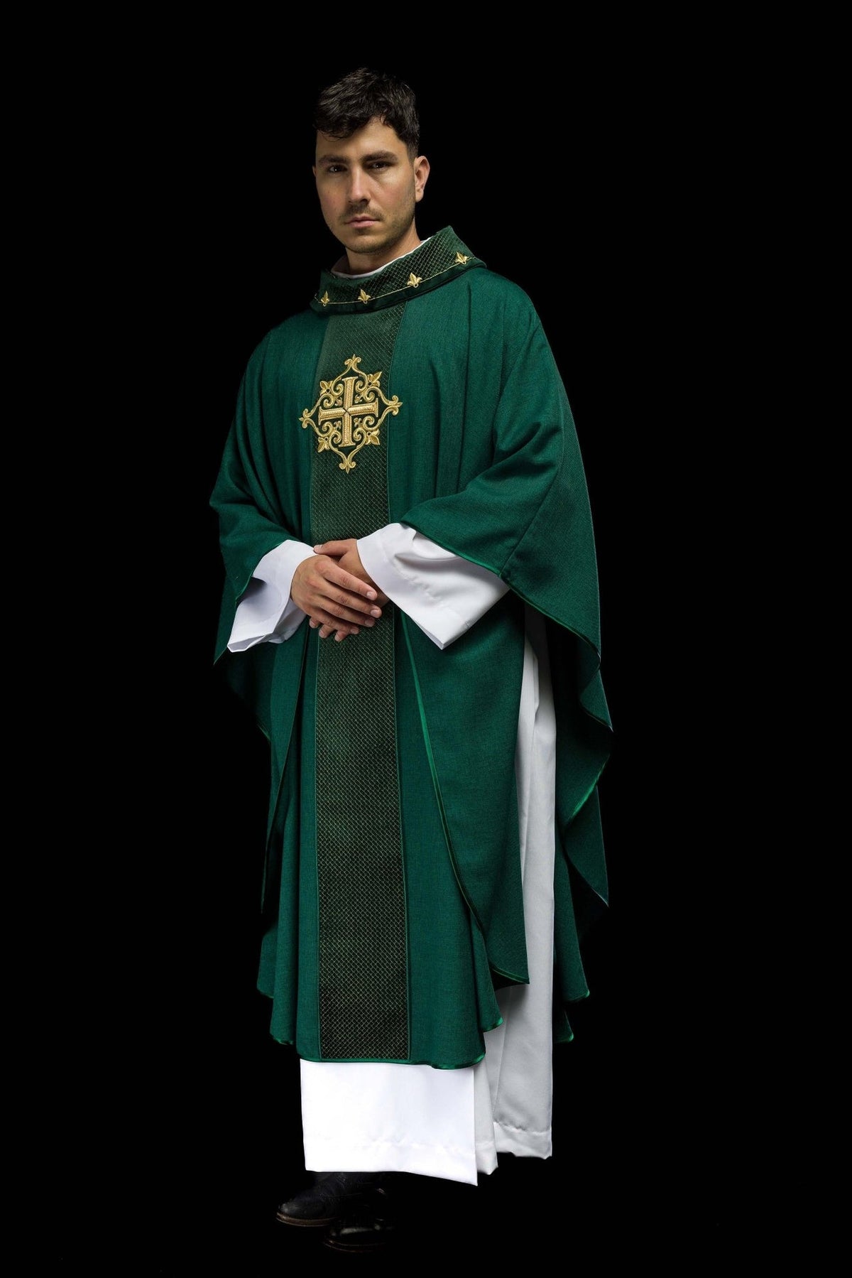 Green chasuble three-quarter front view with embroidered cross and wide flowing sleeves
