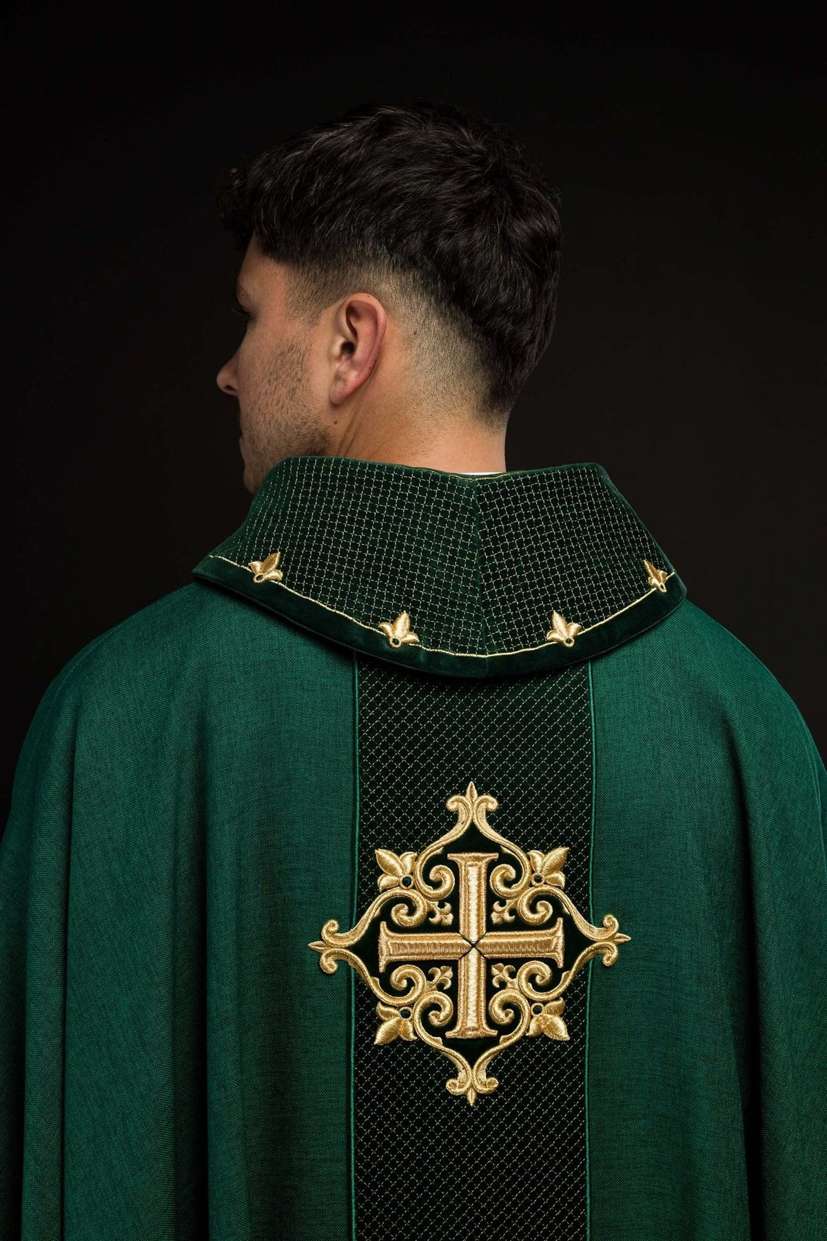 Green chasuble back view with embroidered cross and patterned central panel