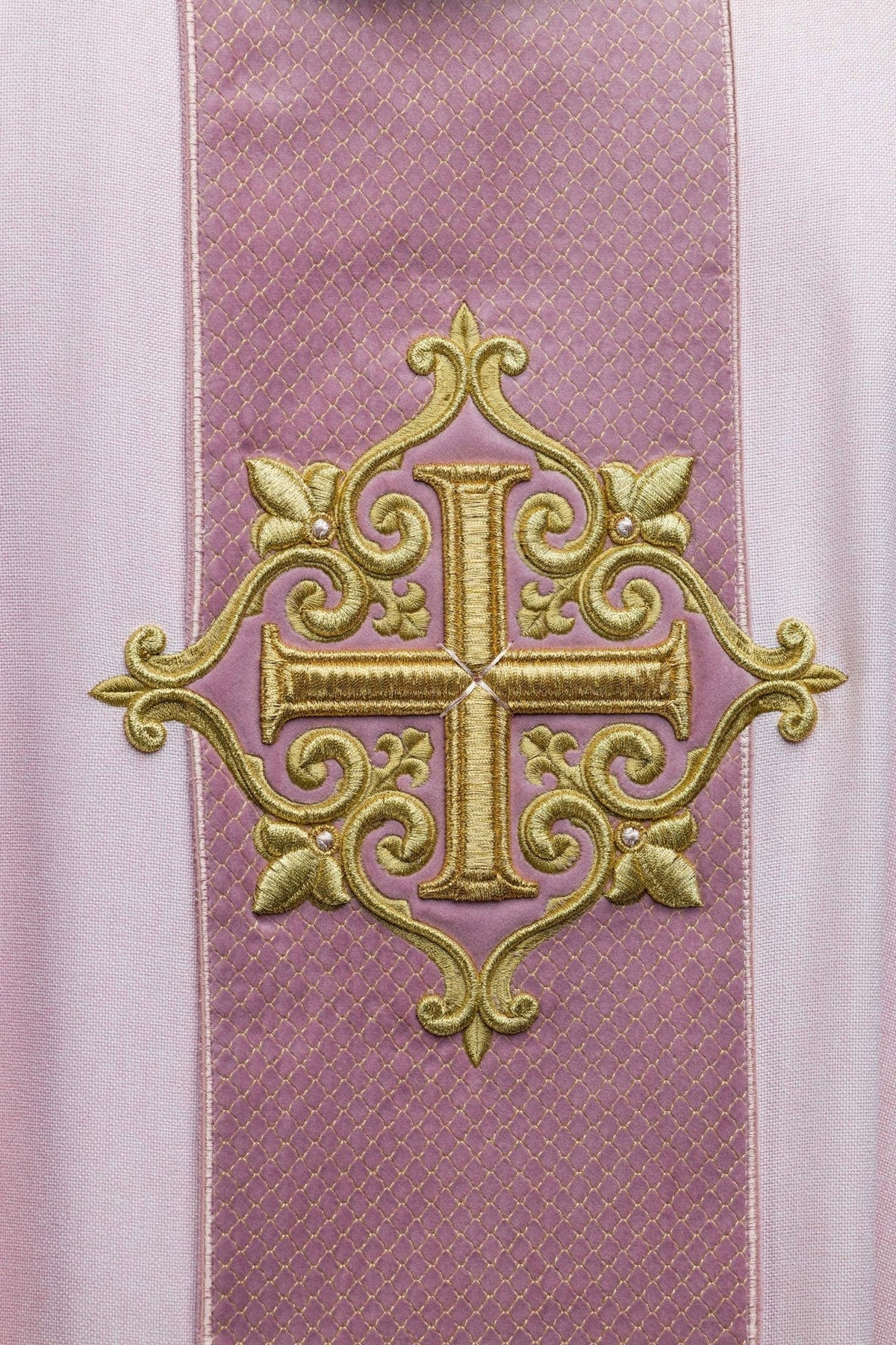 Rose cross embroidery on the pink chasuble's quilted central panel