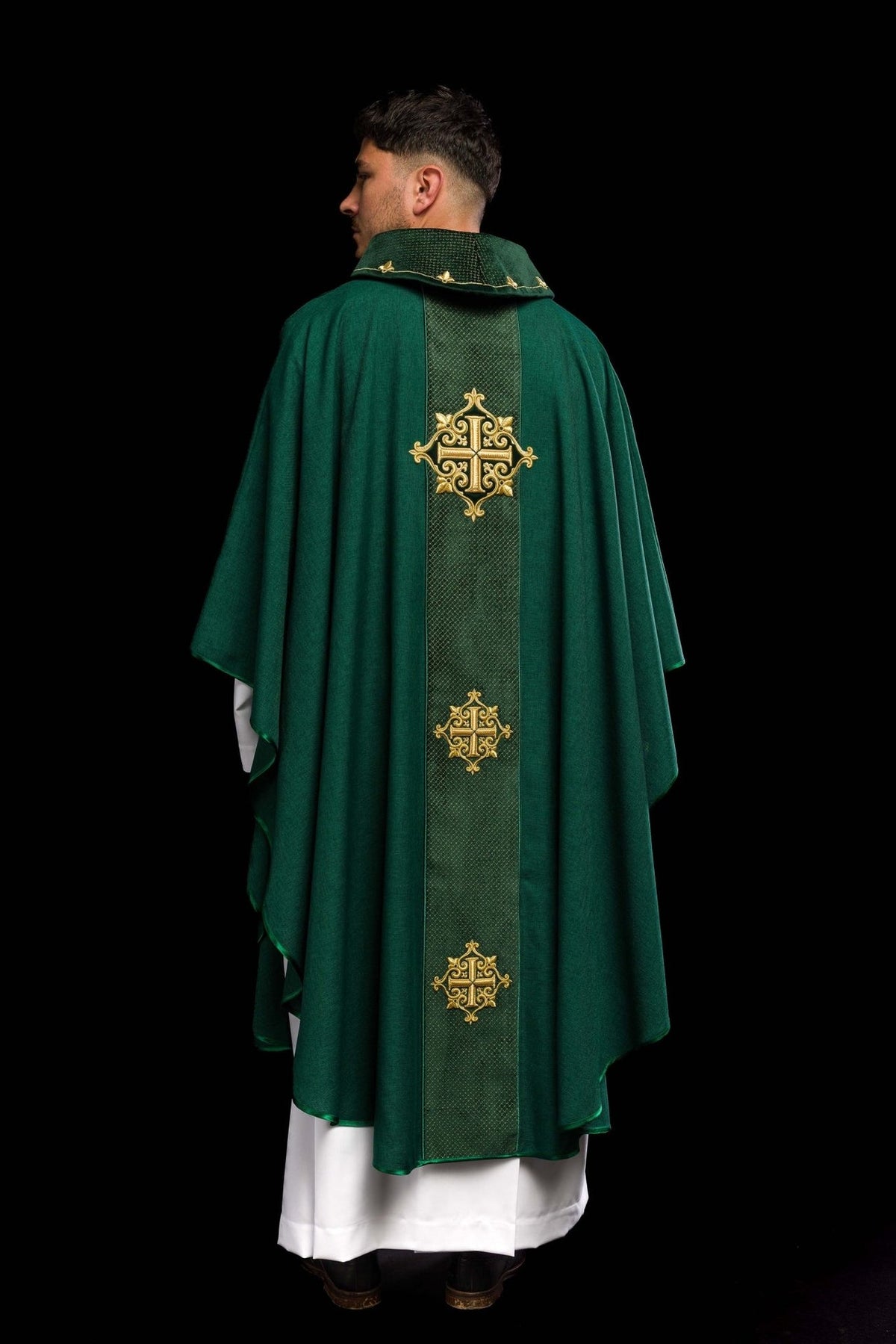 Green chasuble back view with velvet orphrey and gold cross embroidery