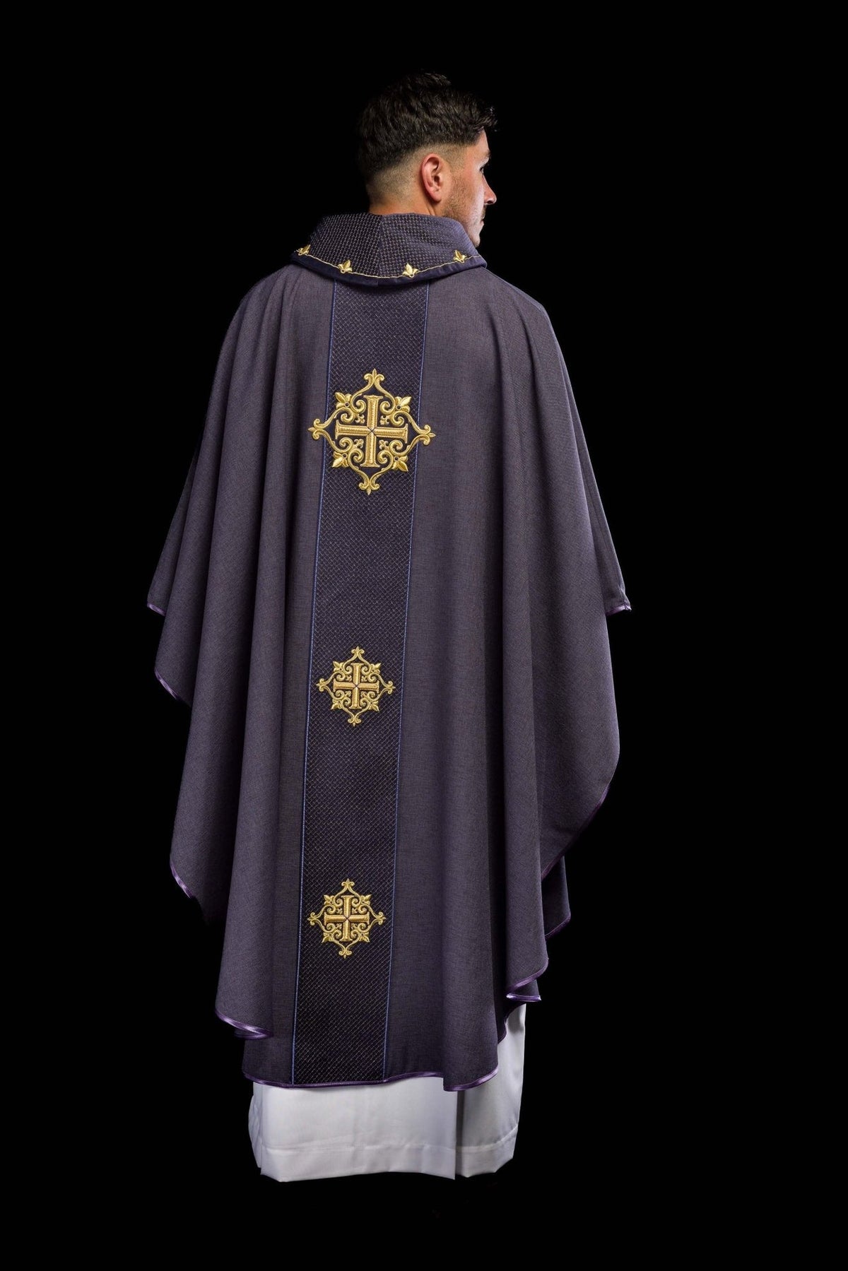Purple velvet chasuble back view with embroidered crosses on the orphrey