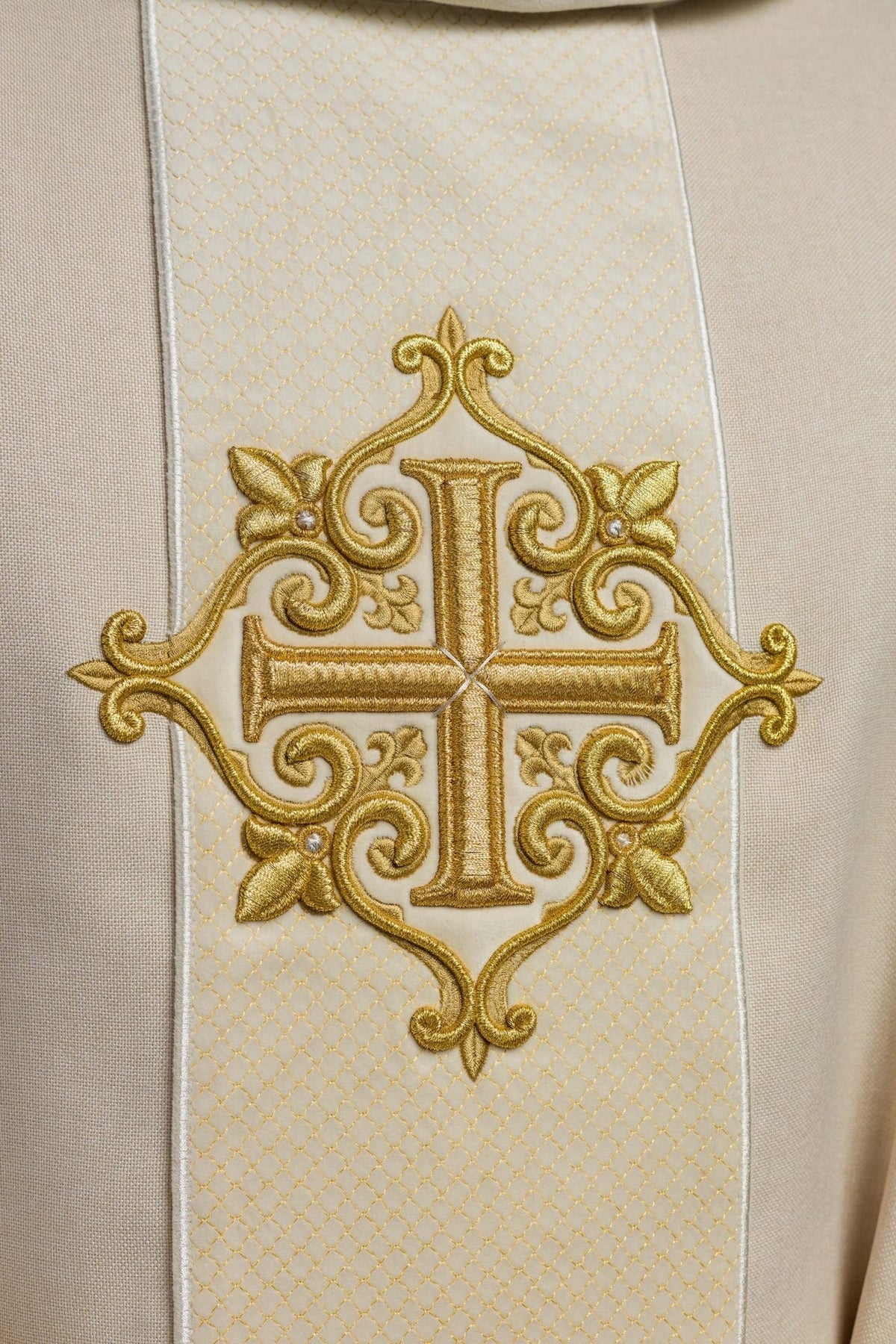 Chasuble close-up of ecru velvet orphrey with gold cross embroidery