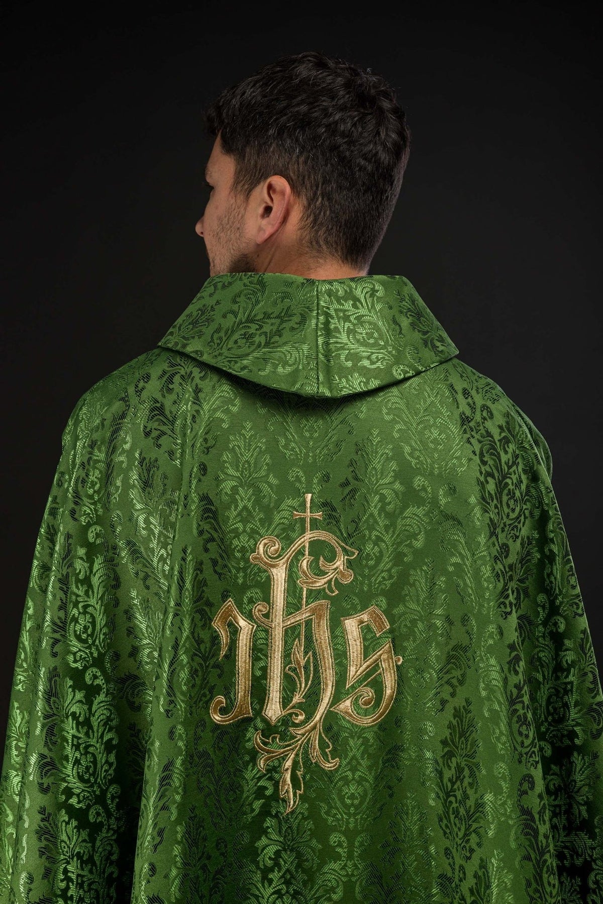 Green chasuble back close-up showing stand-up collar and decorative fabric