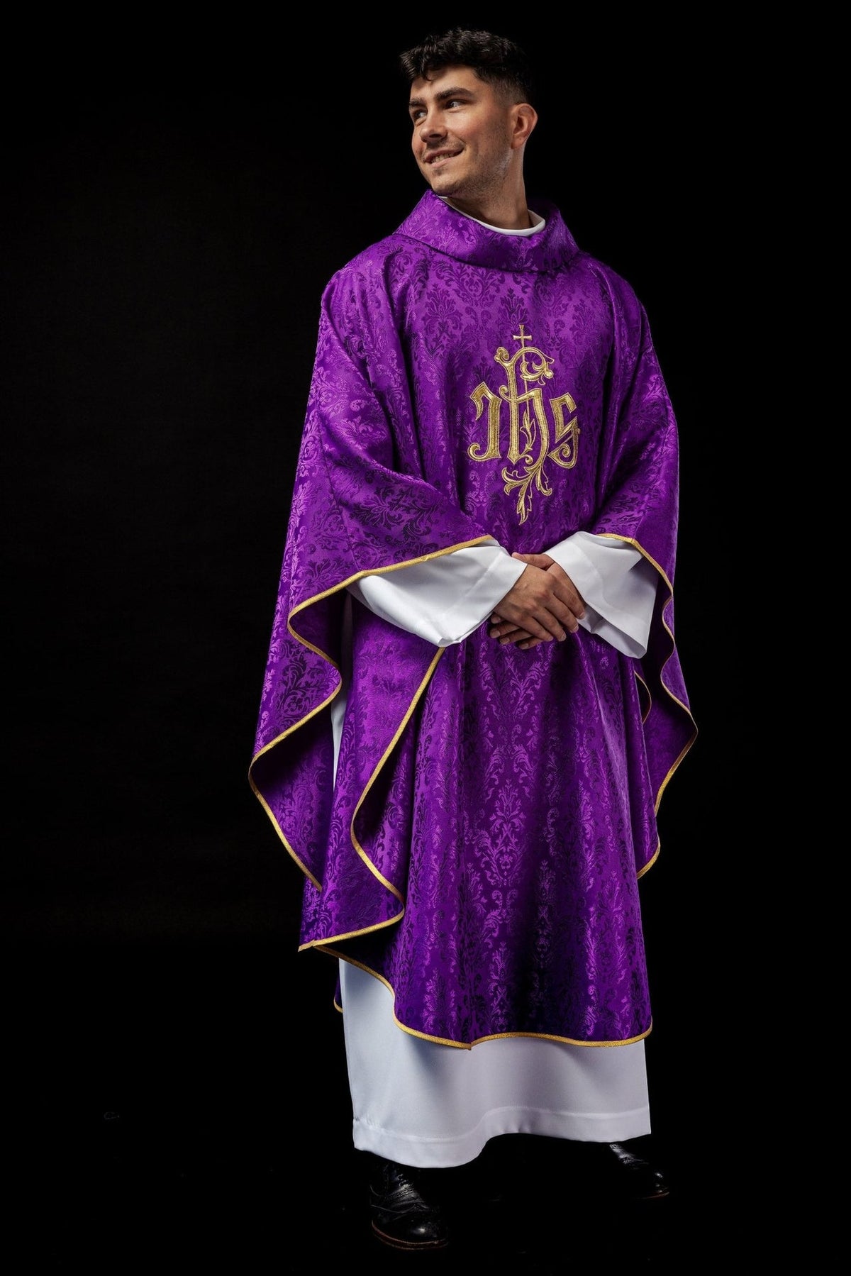 Purple chasuble front view with gold embroidered IHS motif and patterned fabric