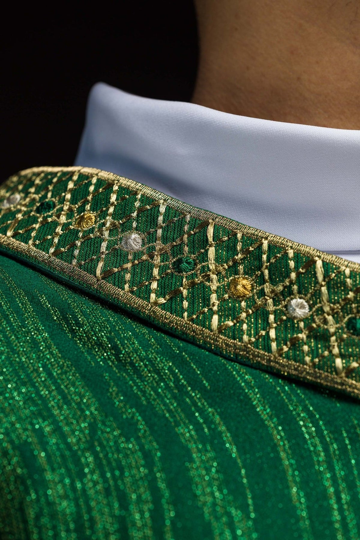 Green chasuble sleeve and white trim detail