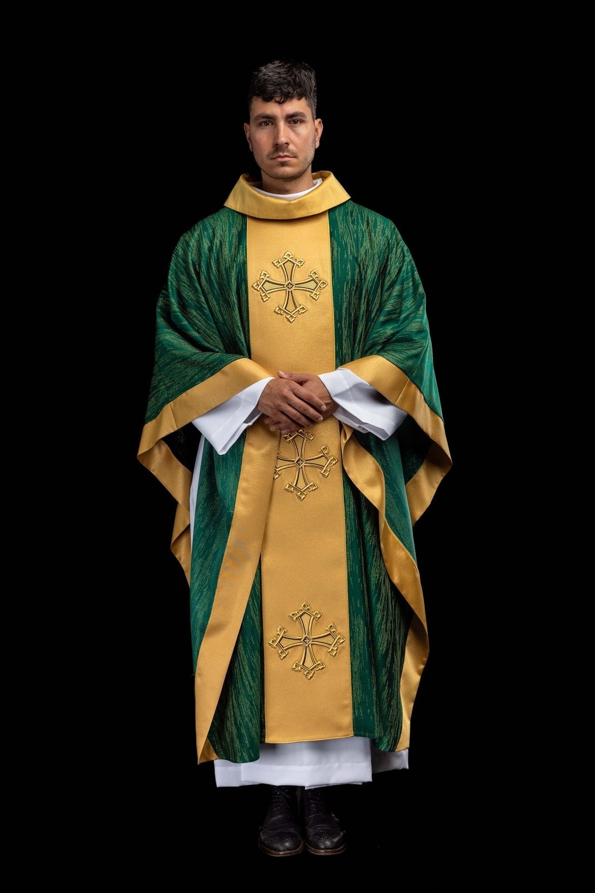 Green chasuble back view with gold orphrey and embroidered crosses
