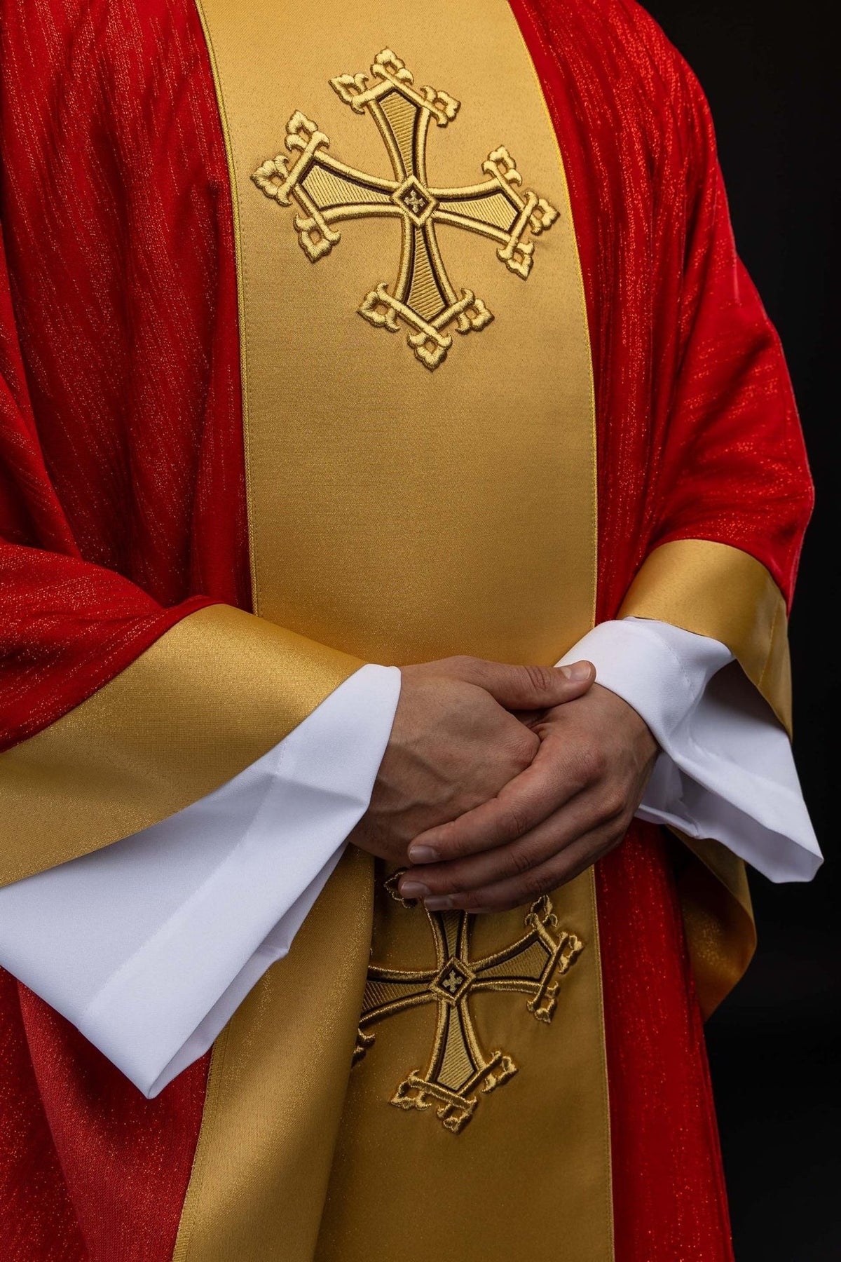 Red chasuble front detail with gold orphrey and cross embroidery