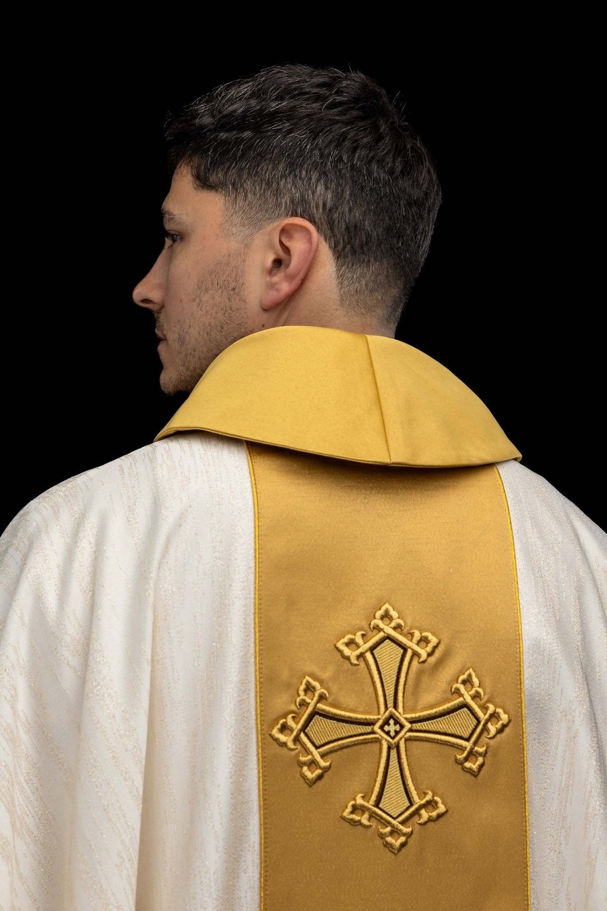 Ecru chasuble back view with gold orphrey and embroidered crosses
