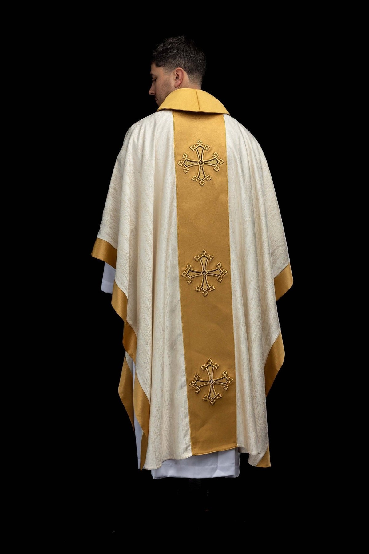Ecru chasuble back view with three embroidered crosses on the gold orphrey