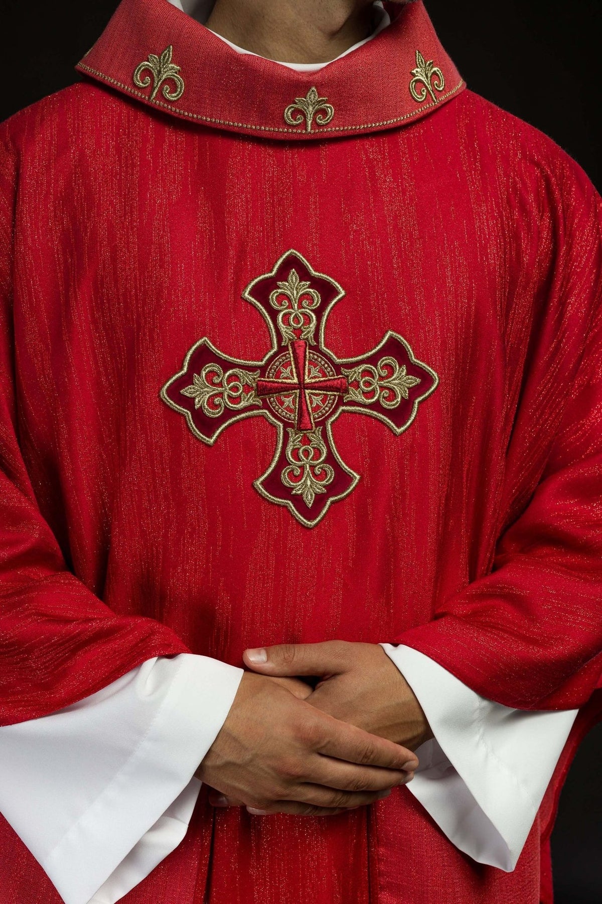 Red chasuble front detail with large embroidered cross and gold stand-up collar motifs