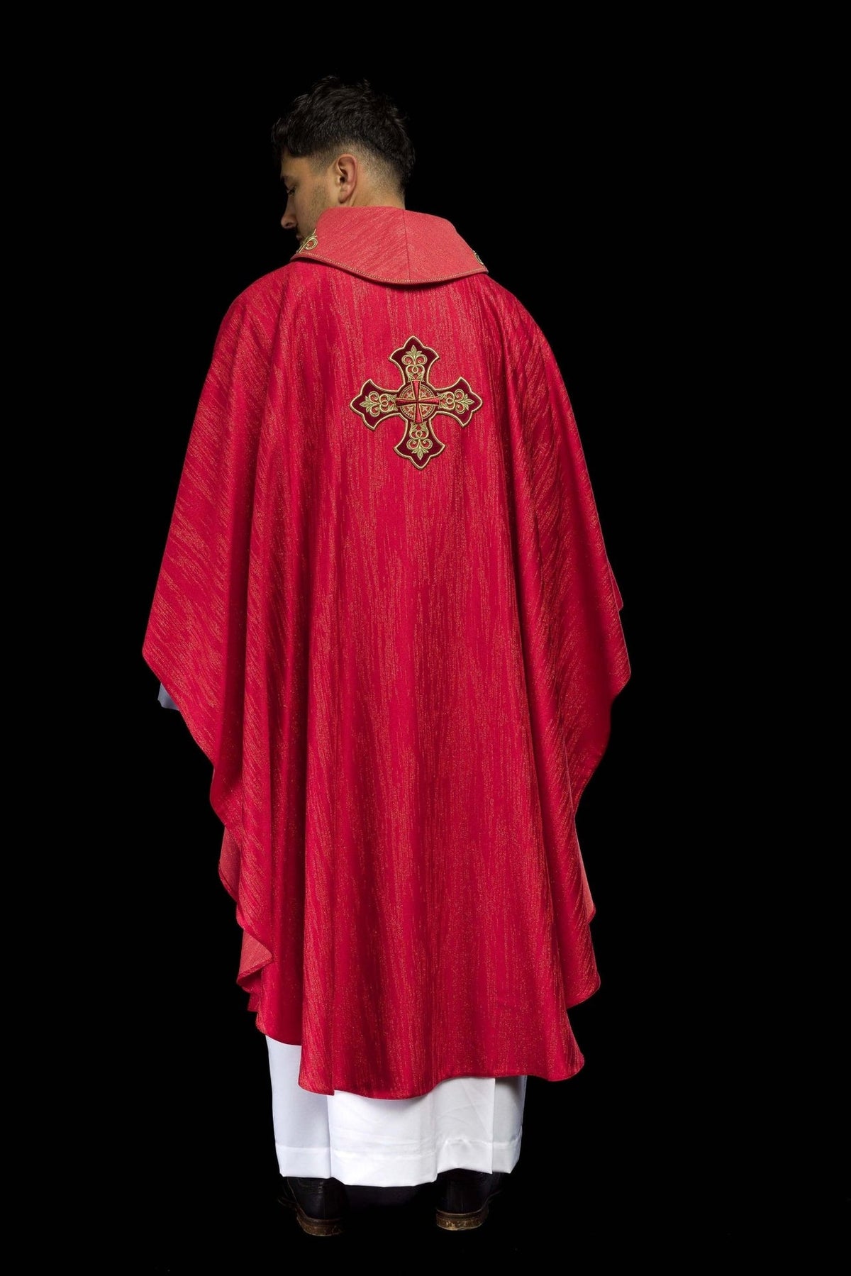 Red chasuble back view with large embroidered gold cross