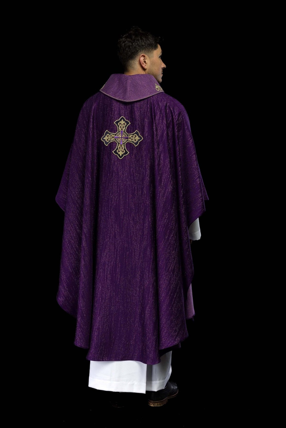 Purple chasuble back view with decorative fabric and cross motif