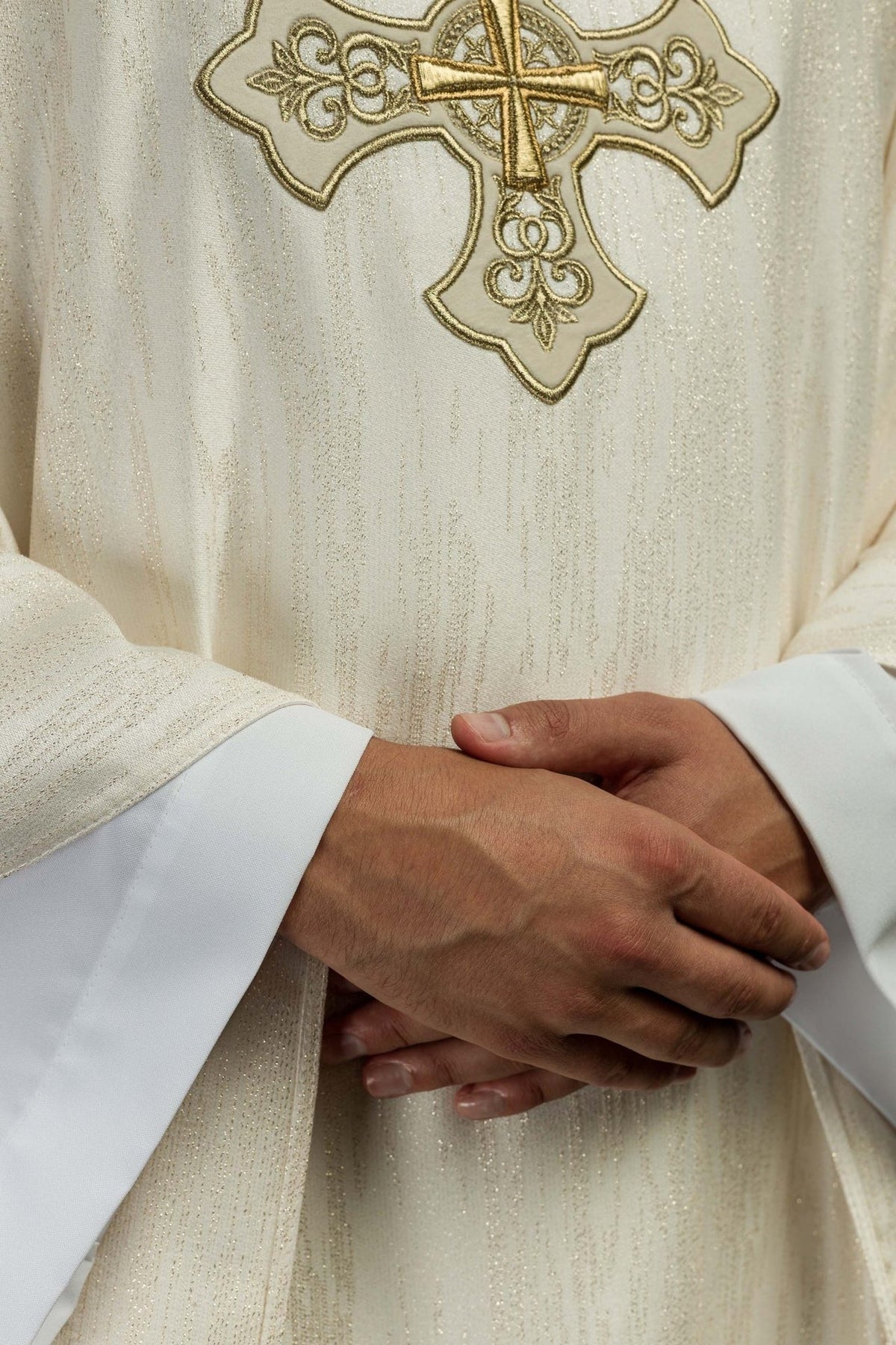 Ecru chasuble close-up showing stand-up collar with gold embroidery