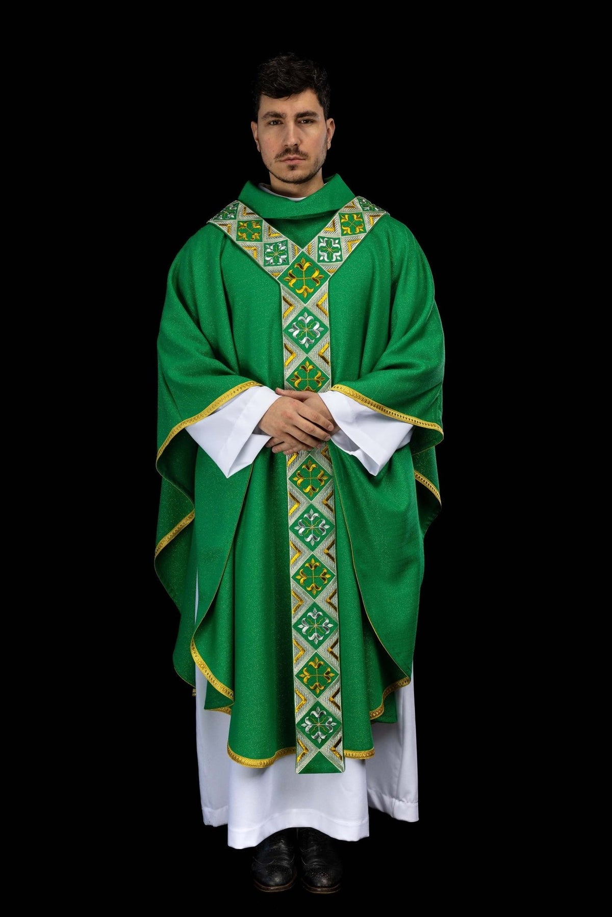 Green chasuble worn full length from the front with embroidered orphrey and gold trim